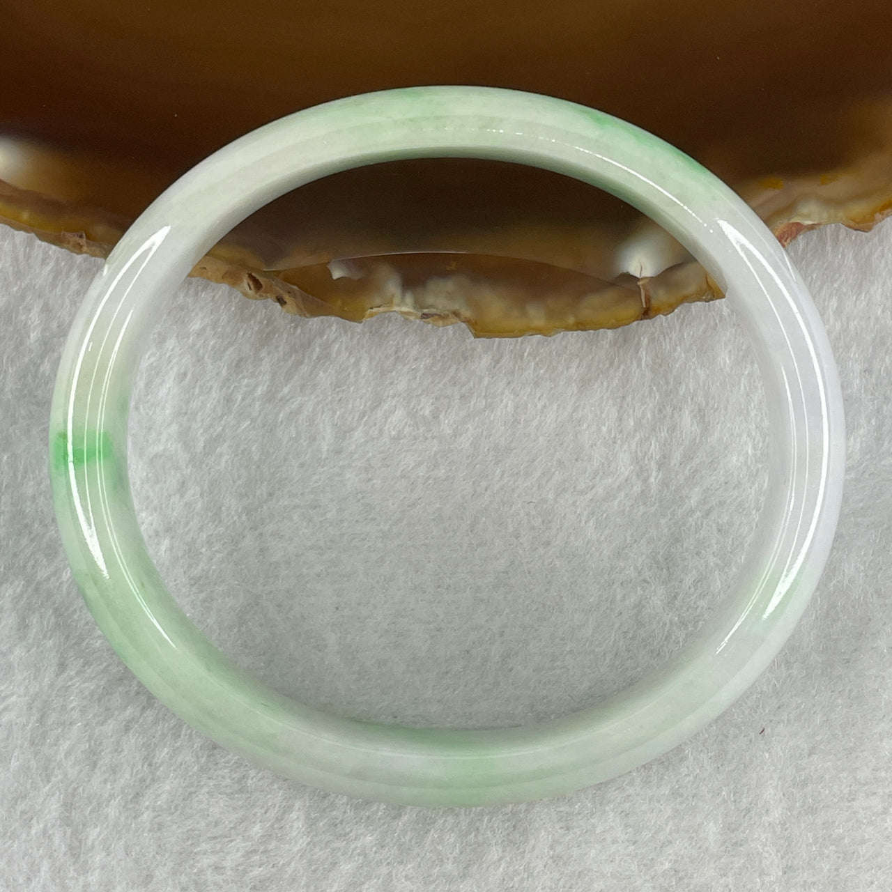 Certified Natural Type A Faint Lavender with Emerald Green Patches Jadeite Oval Bangle 32.89g Inner Diameter 55.4mm Thickness 12.2 by 5.7mm (Slight External Line)