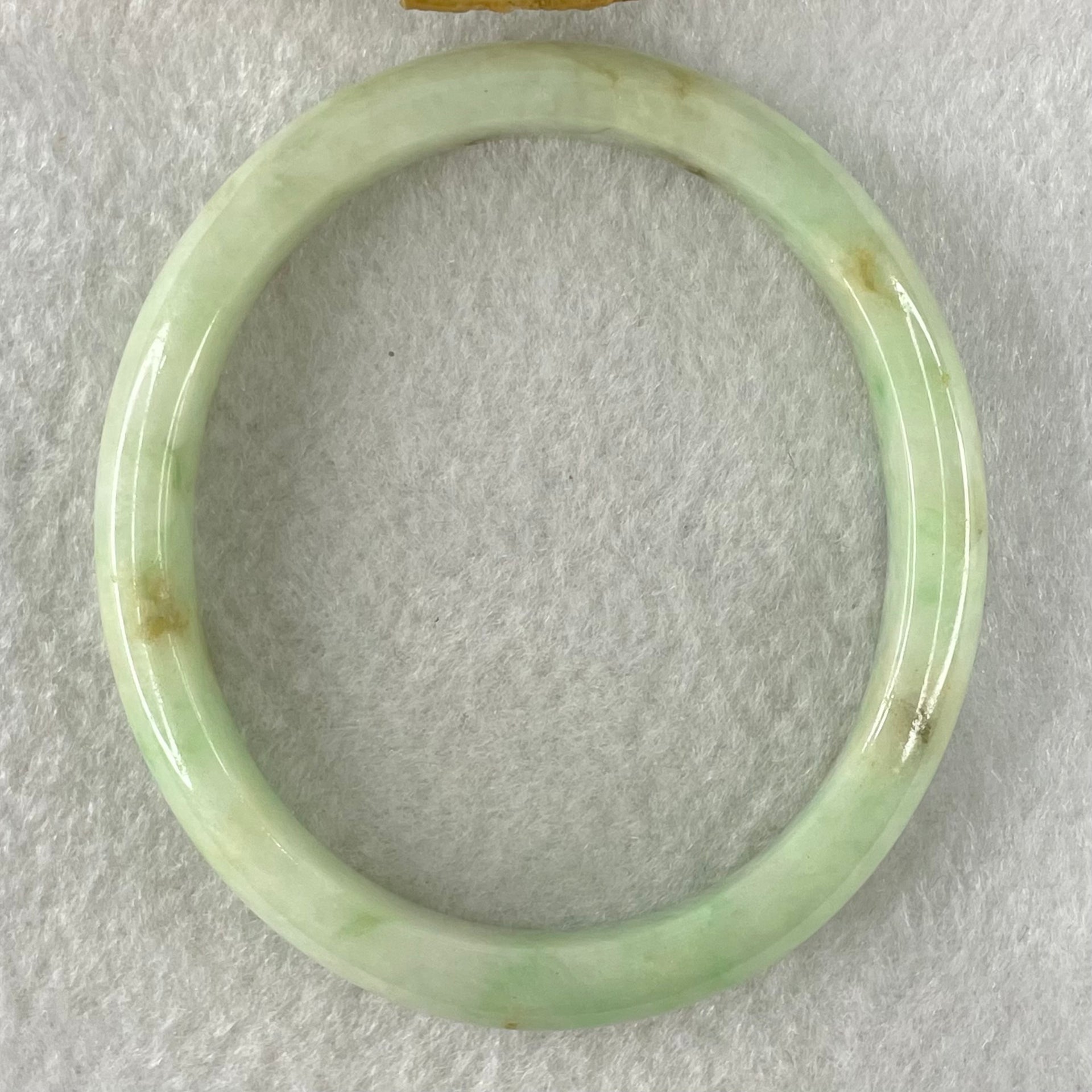 Type A Green with Brown Patches Jadeite Oval Bangle 31.51g Internal Diameter 55.6mm 10.3 by 6.6mm (External Roughs and Internal Lines) - Huangs Jadeite and Jewelry Pte Ltd