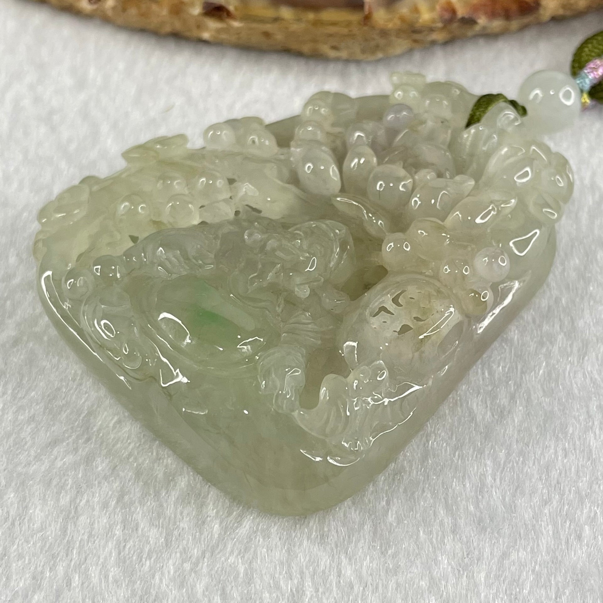 Grandmaster Type A Faint Lavender with Light Green Jadeite Cai Shen Ye with Prosperity Flowers and Bird 天宫赐福 Pendant 62.62g 56.88 by 46.94 by 13.07mm With NGI Cert 82838783 - Huangs Jadeite and Jewelry Pte Ltd