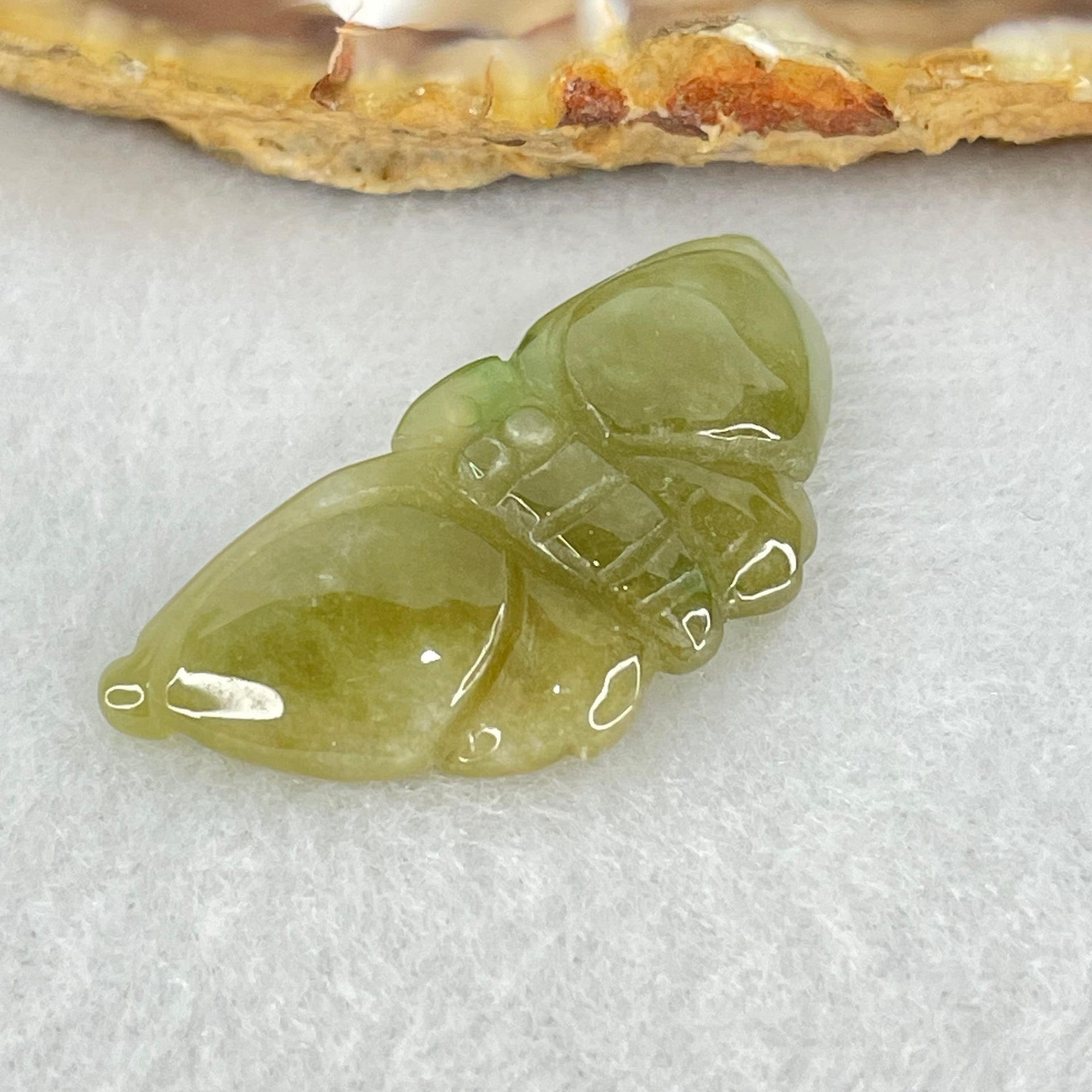 Type A Brownish Green Jadeite Butterfly Pendant 3.44g 32.9 by 14.8 by 6.1mm - Huangs Jadeite and Jewelry Pte Ltd