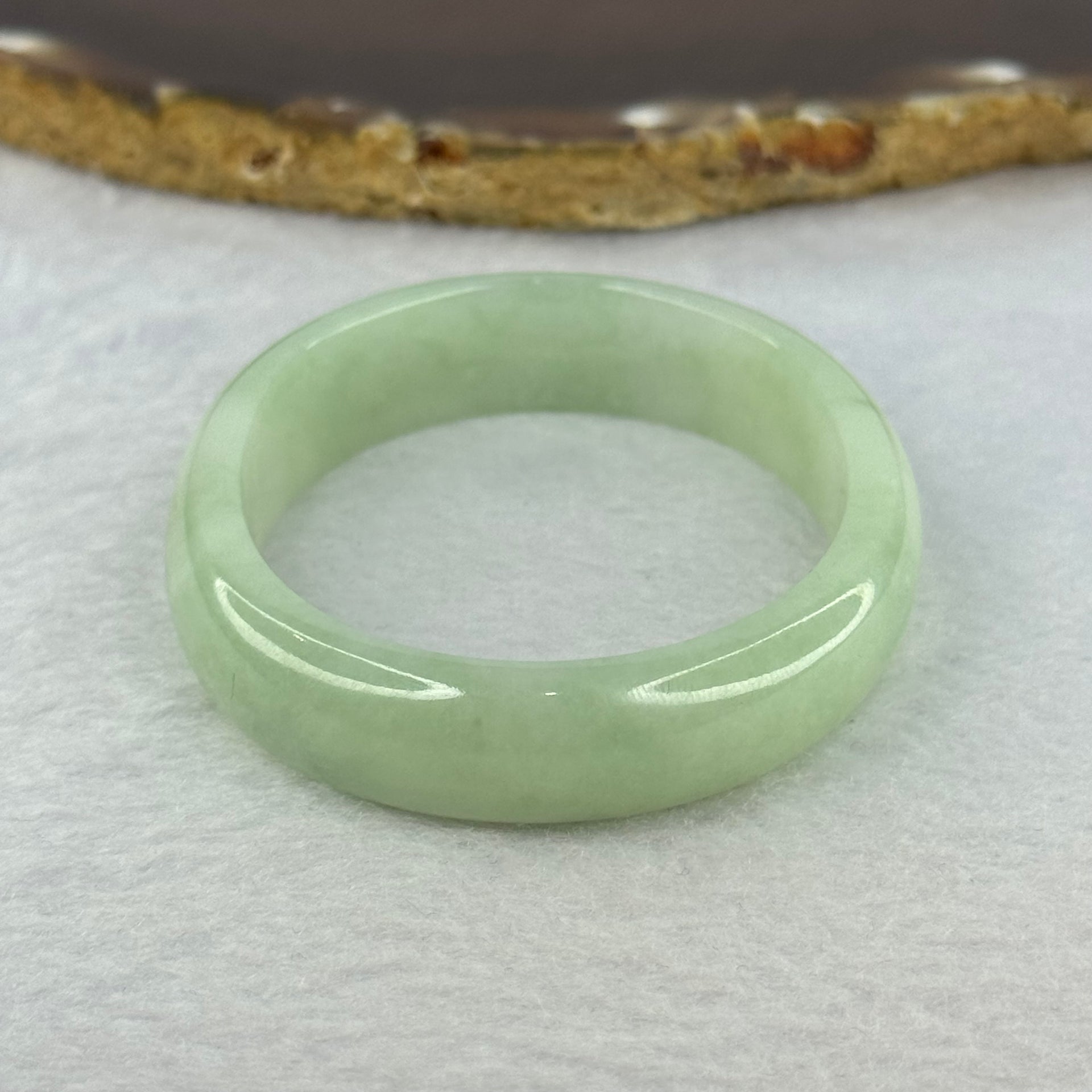 Type A Light Apple Green Jadeite Oval Bangle 33.35g Internal Diameter 52.3mm 12.2 by 6.5mm (Very Slight Fine Internal Lines) - Huangs Jadeite and Jewelry Pte Ltd