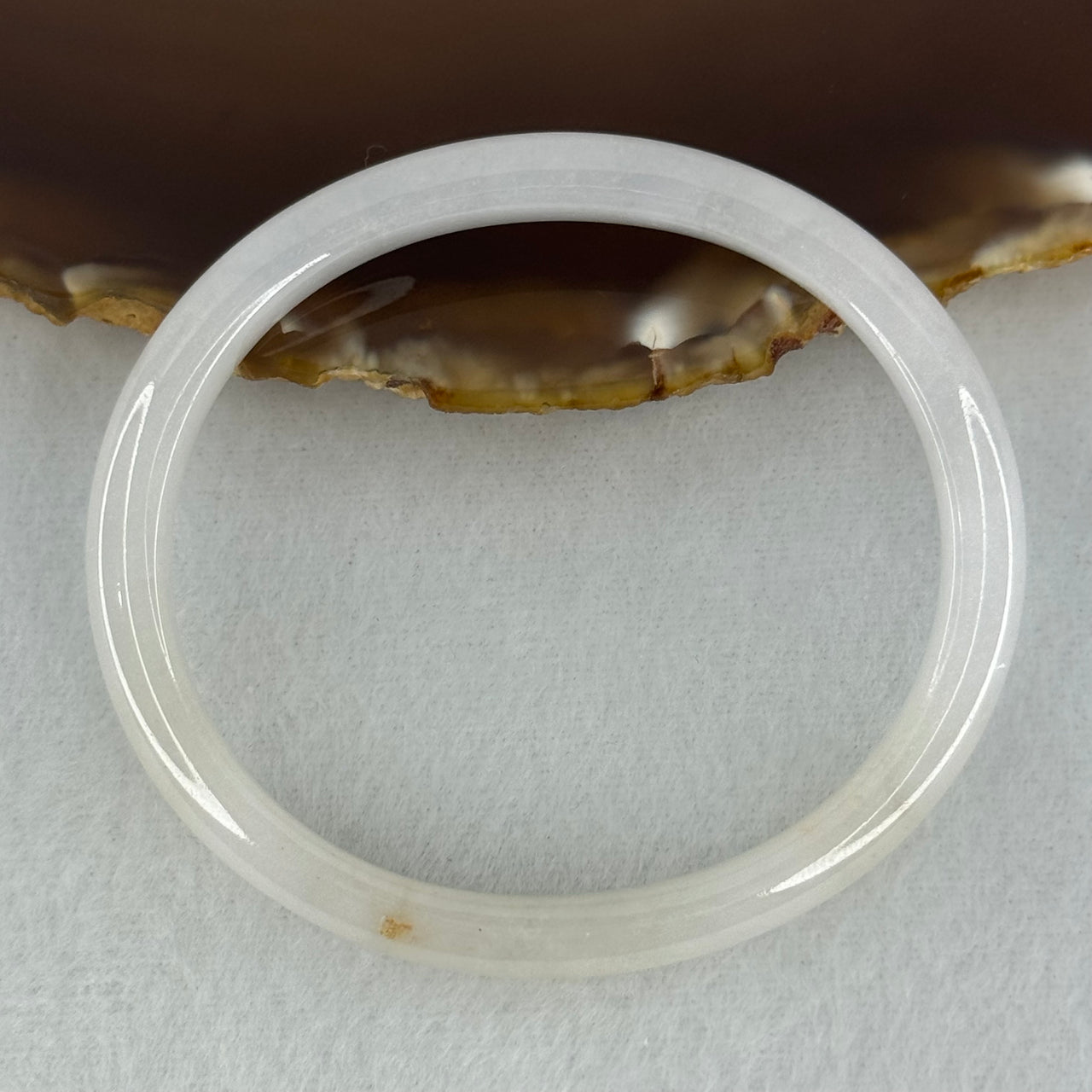 Type A Semi Icy Faint Lavender Green with Reddish Spot Jadeite Oval Bangle Internal Diameter 54.4mm 21.33g 7.5 by 6.0mm (very slight internal line) - Huangs Jadeite and Jewelry Pte Ltd