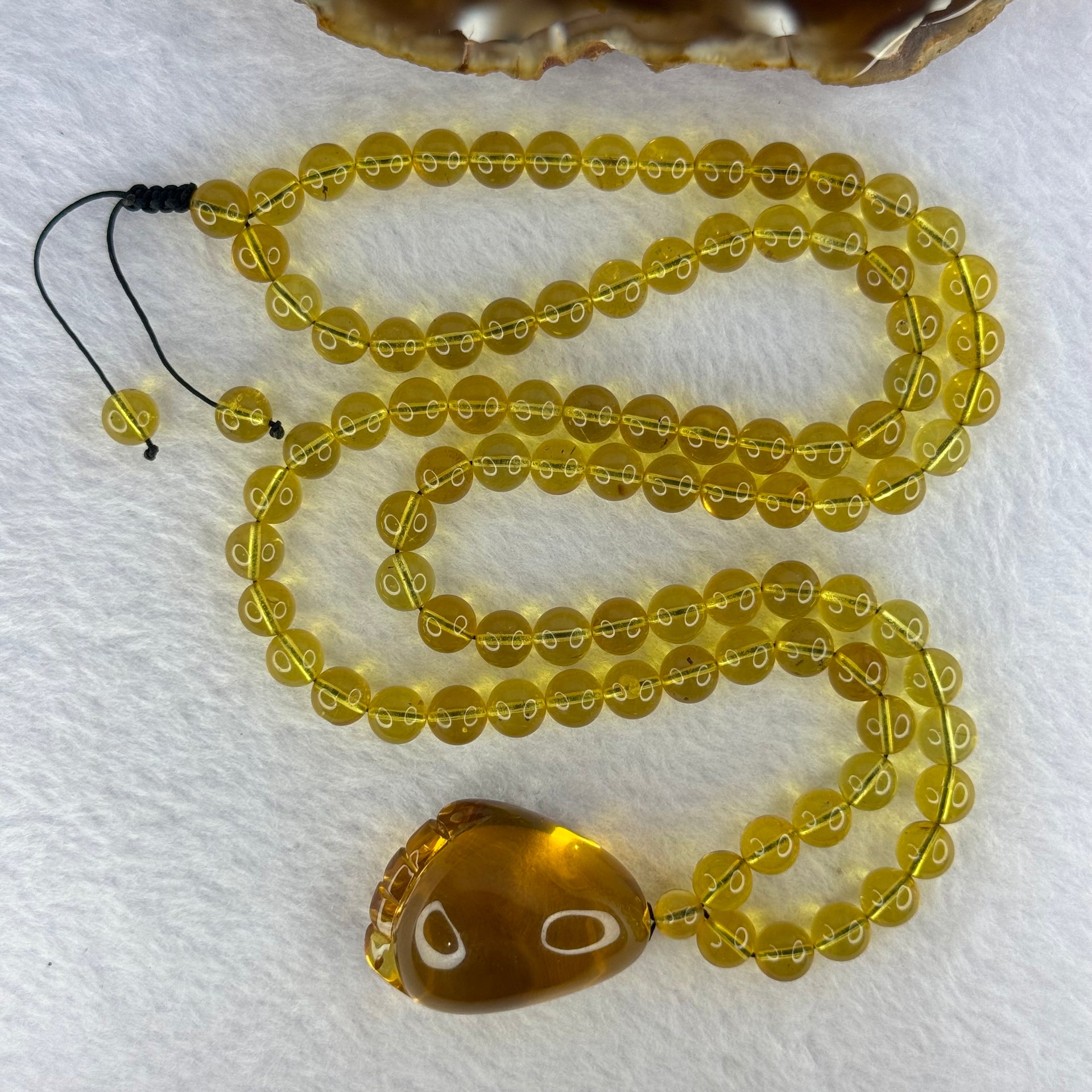 Natural Yellow Amber Foot Pendent 32.5 by 24.2 by 19.5mm with Yellow Amber Beads Necklace 6.9mm 104 Beads Total 22.56g - Huangs Jadeite and Jewelry Pte Ltd