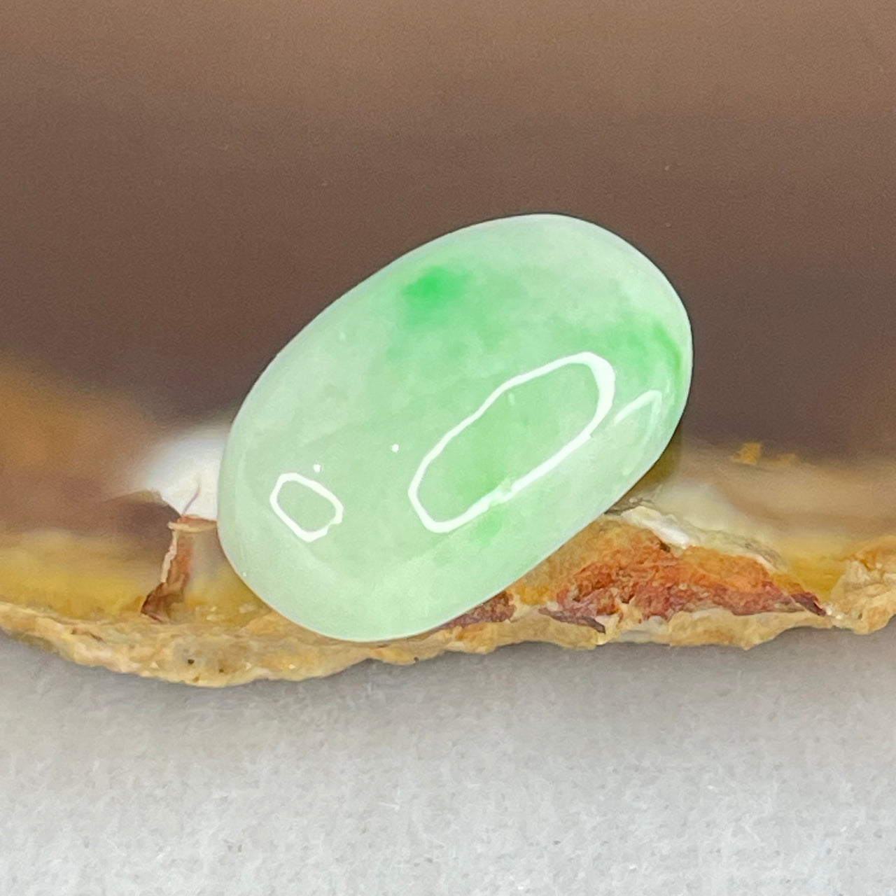 Type A Light Green with Apple Green Patches Jadeite Oval Cabouchon Stone For Setting 2.90g 17.2 by 10.2 by 7.7mm - Huangs Jadeite and Jewelry Pte Ltd