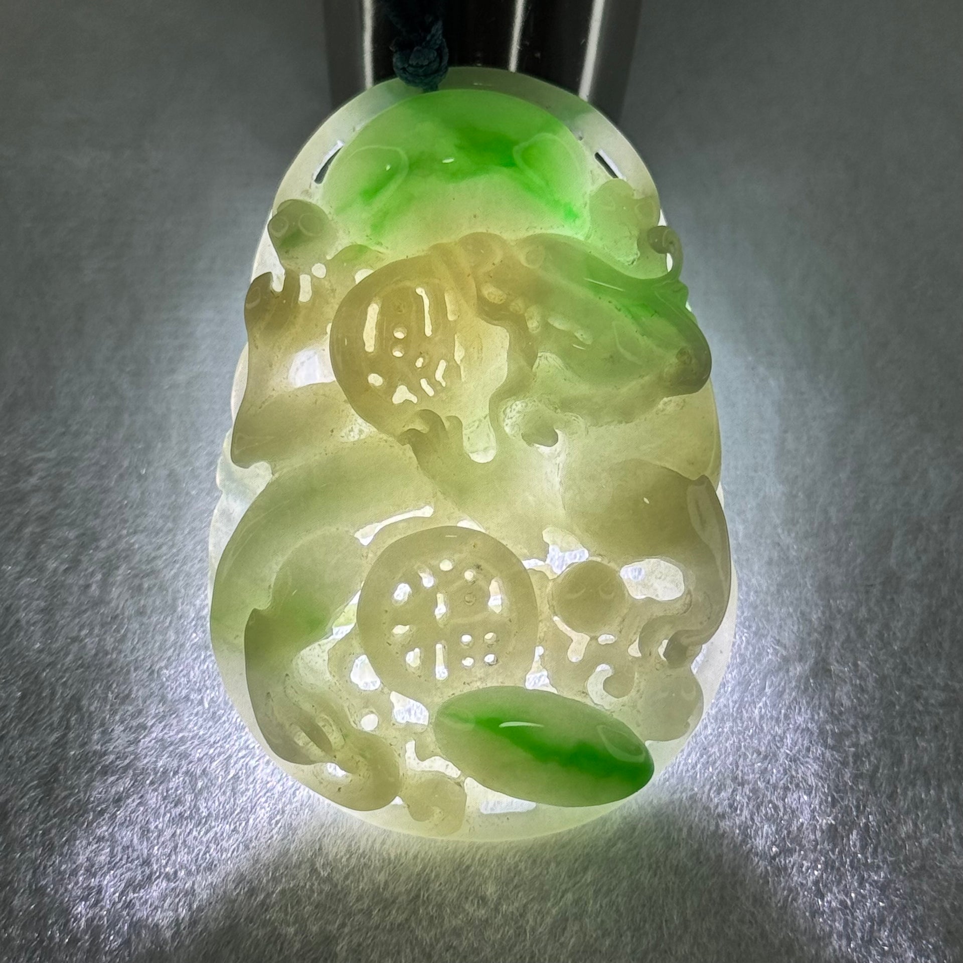 Type A Natural Light Green with Apple Green Jadeite 3D Dragon In Hollow Carving Pendant 27.58g 58.65 by 39.42 by 8.48mm with NGI Cert No. 16824716 - Huangs Jadeite and Jewelry Pte Ltd