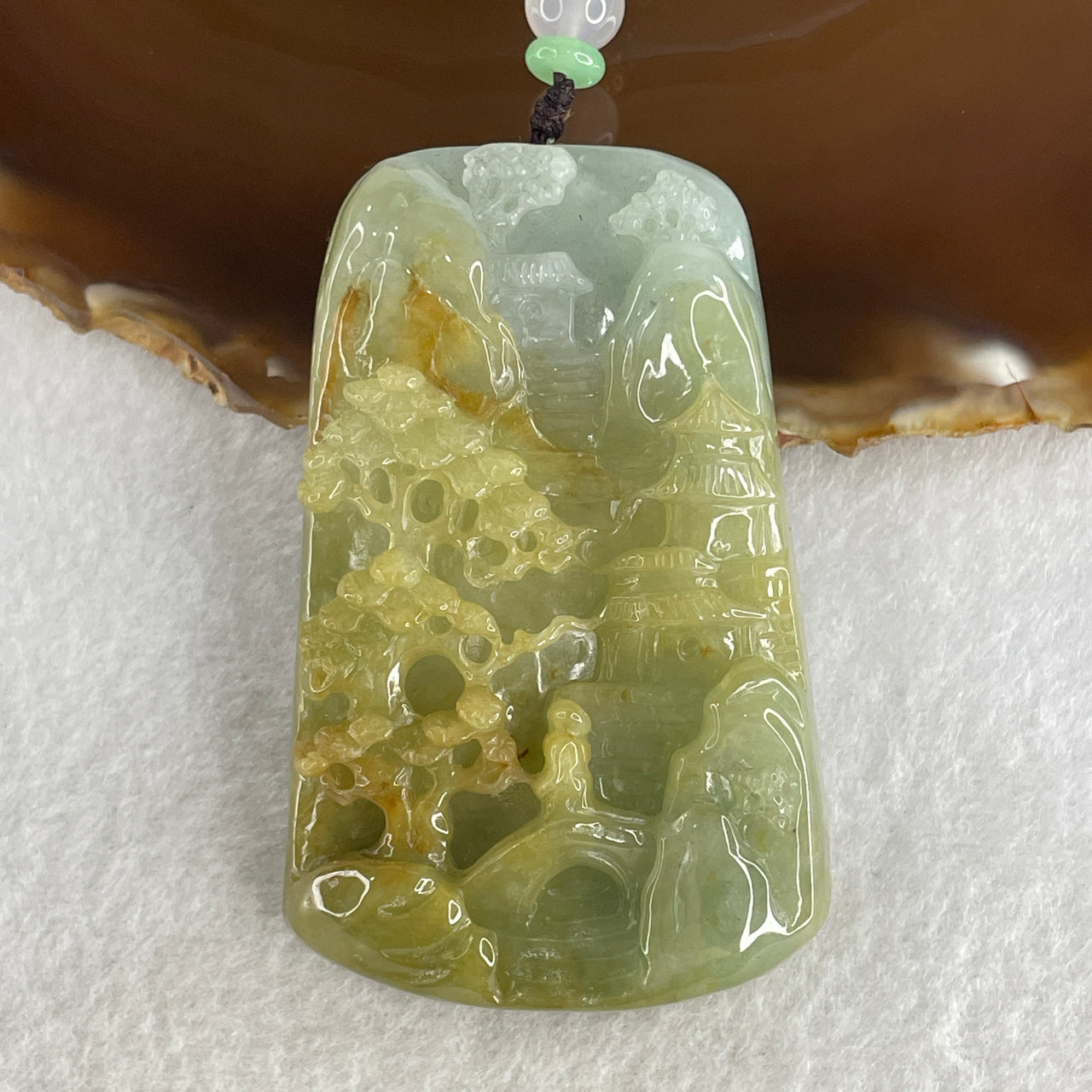 Natural Type A Yellowish Green with Sky Blue Jadeite Shan Shui with Gui Ren Benefactor Pendant 76.29g 67.4 by 43.0 by 12.0mm - Huangs Jadeite and Jewelry Pte Ltd
