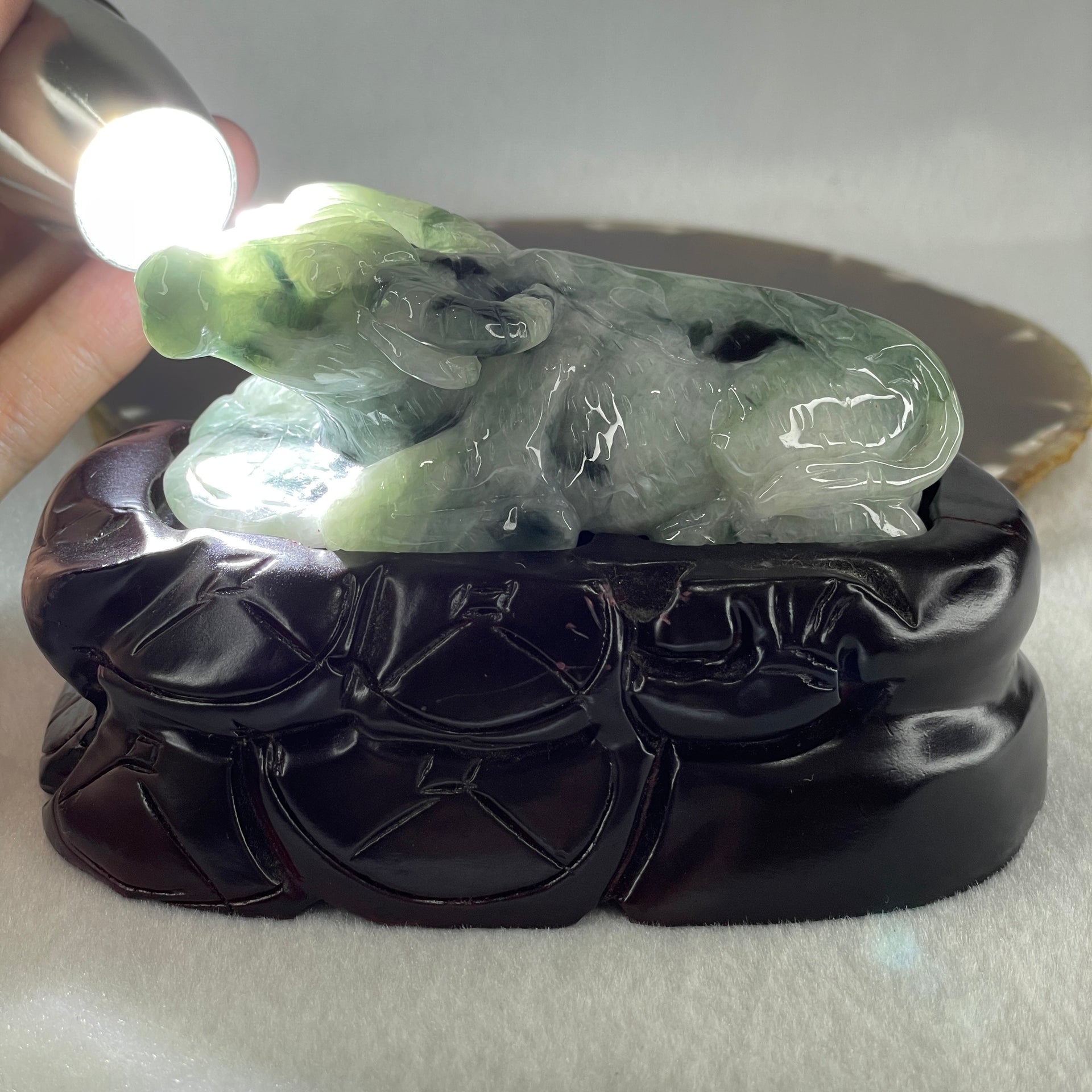 Natural Type A Light Green Light Lavender with Dark Green Patches Jadeite Ox with Wooden Stand Display 341.7g 116.5 by 73.9 by 66.0mm - Huangs Jadeite and Jewelry Pte Ltd