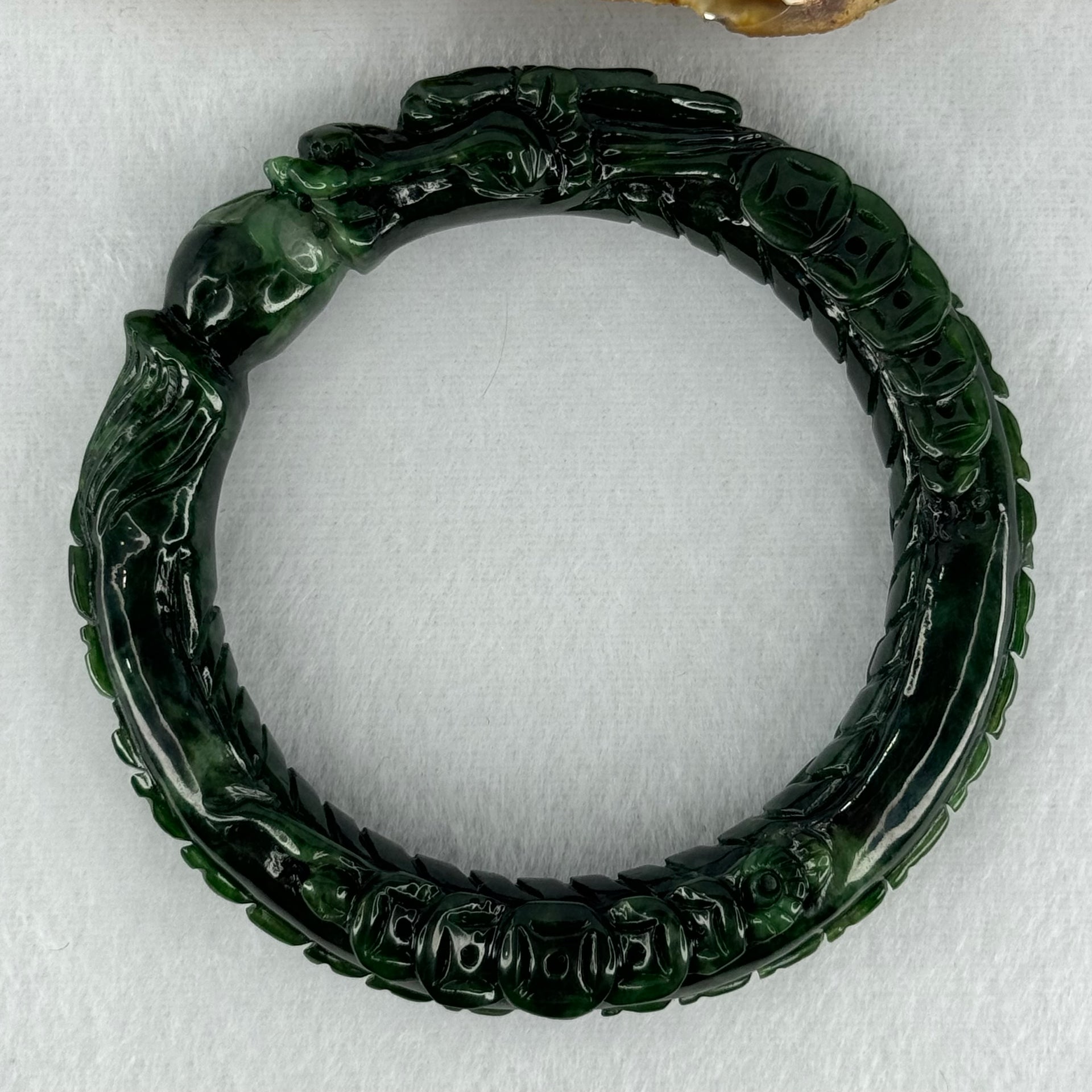 Type A Translucent to Opaque Old Mine Spicy Green Jadeite Dragon Bangle Internal Diameter 56.30mm 374.20cts 74.75g 16.0 by 12.5mm With NGI Cert 32885979 (Slight Internal Lines) - Huangs Jadeite and Jewelry Pte Ltd