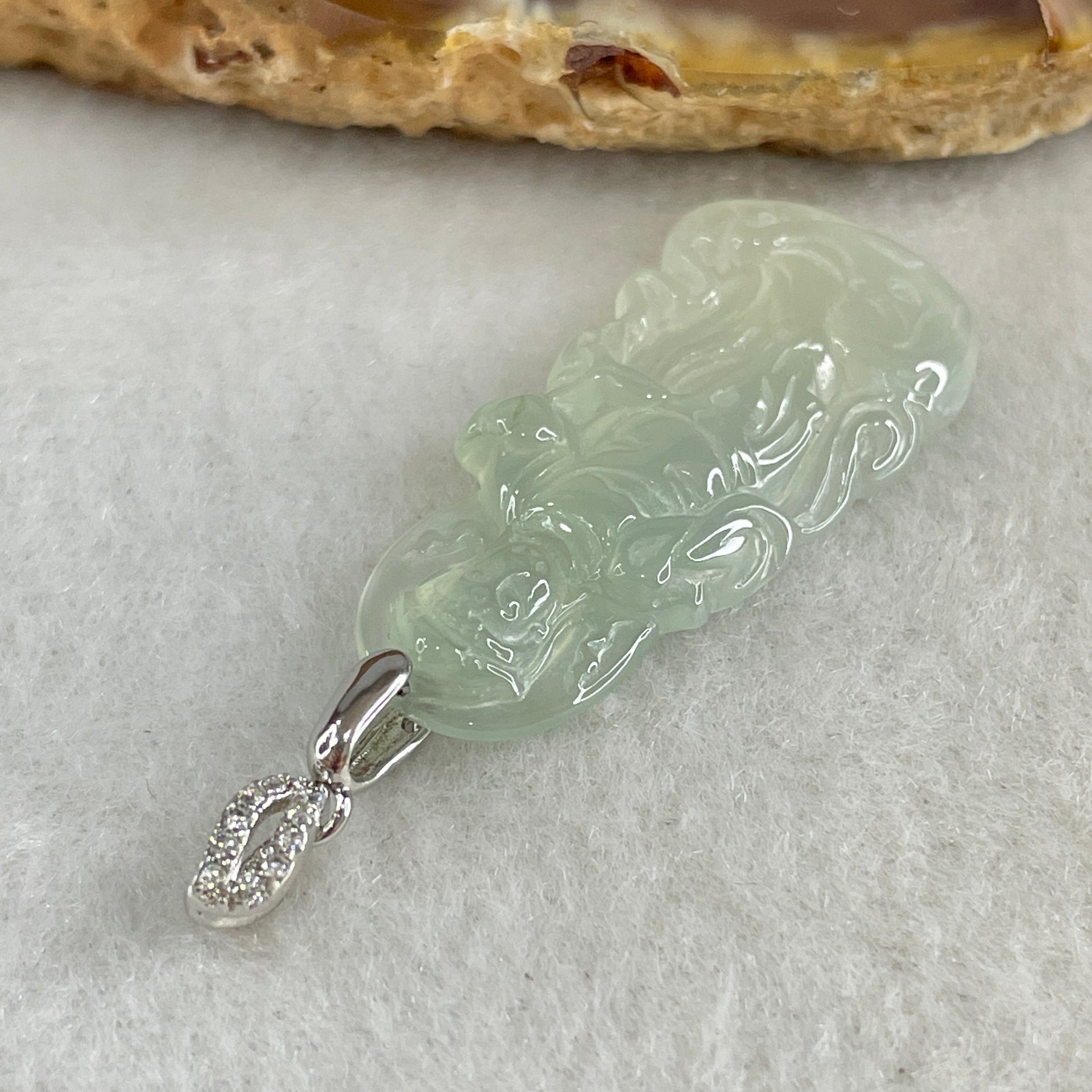 Type A Icy Colourless to Faint Green Jadeite Guan Yin Pendant 3.0g 31.0 by 14.5 by 3.5mm - Huangs Jadeite and Jewelry Pte Ltd
