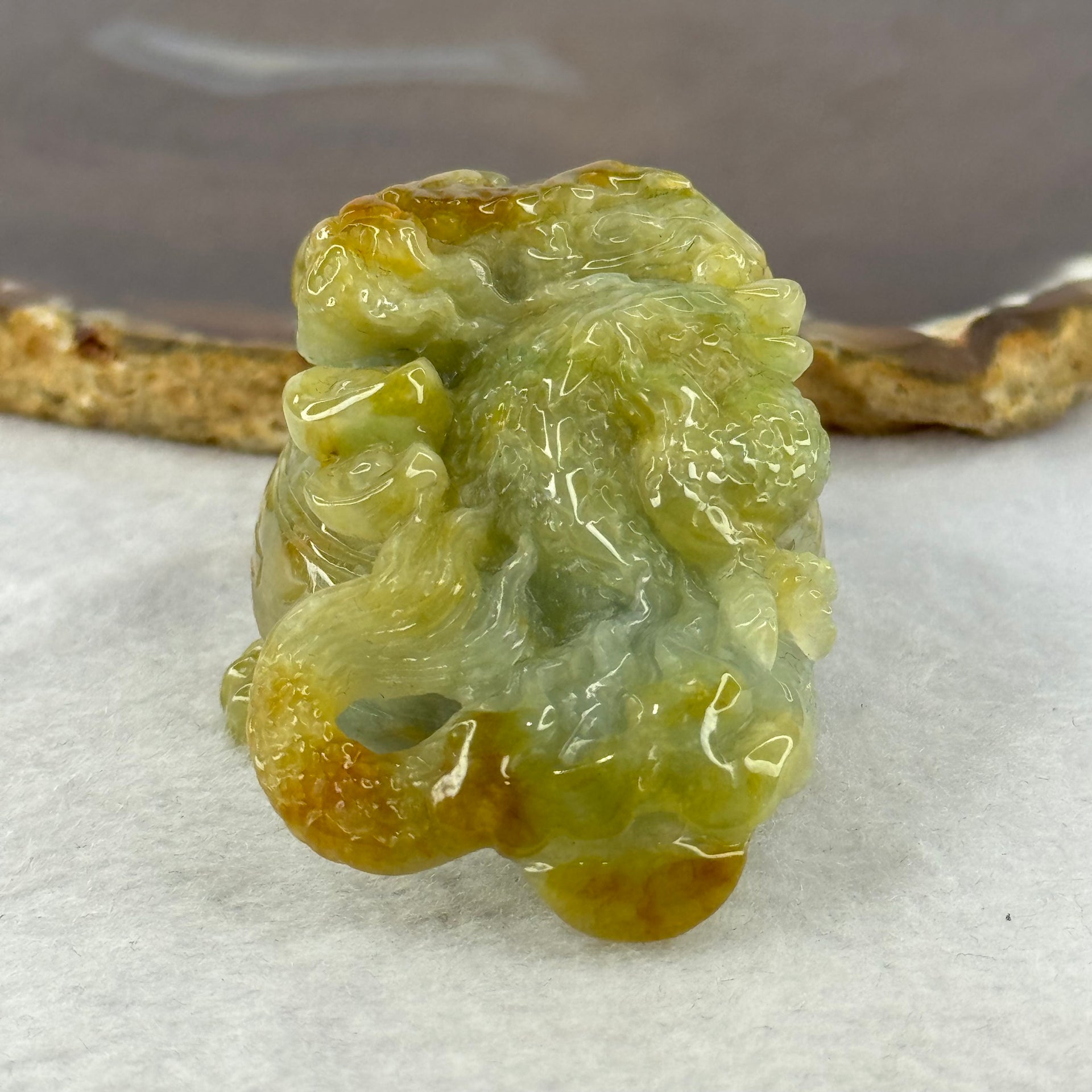 Grand Master Type A Blueish Green with Brownish Yellow Jadeite Dragon on Wealth Pot with Treasures 133.13g 36.0 by 69.3 by 39.5mm - Huangs Jadeite and Jewelry Pte Ltd