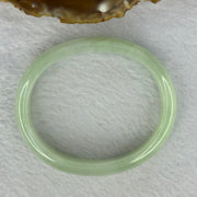 Type A Light Apple Green Jadeite Oval Bangle 33.35g Internal Diameter 52.3mm 12.2 by 6.5mm (Very Slight Fine Internal Lines) - Huangs Jadeite and Jewelry Pte Ltd