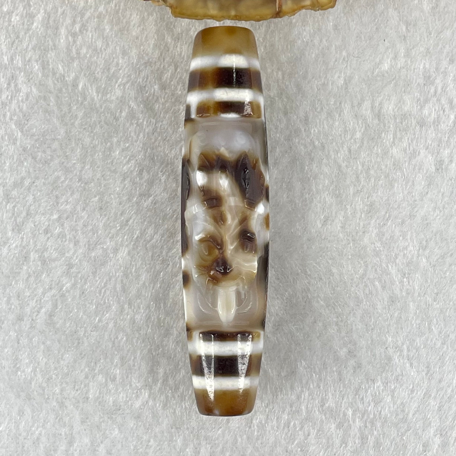 Natural Powerful Tibetan Old Oily Agate Zha Ji La Mu Female Cai Shen Carvings on 9 Eyes Dzi Bead Heavenly Master (Tian Zhu) 九眼扎基拉姆女财神天珠 13.88g 57.4 by 13.3mm - Huangs Jadeite and Jewelry Pte Ltd