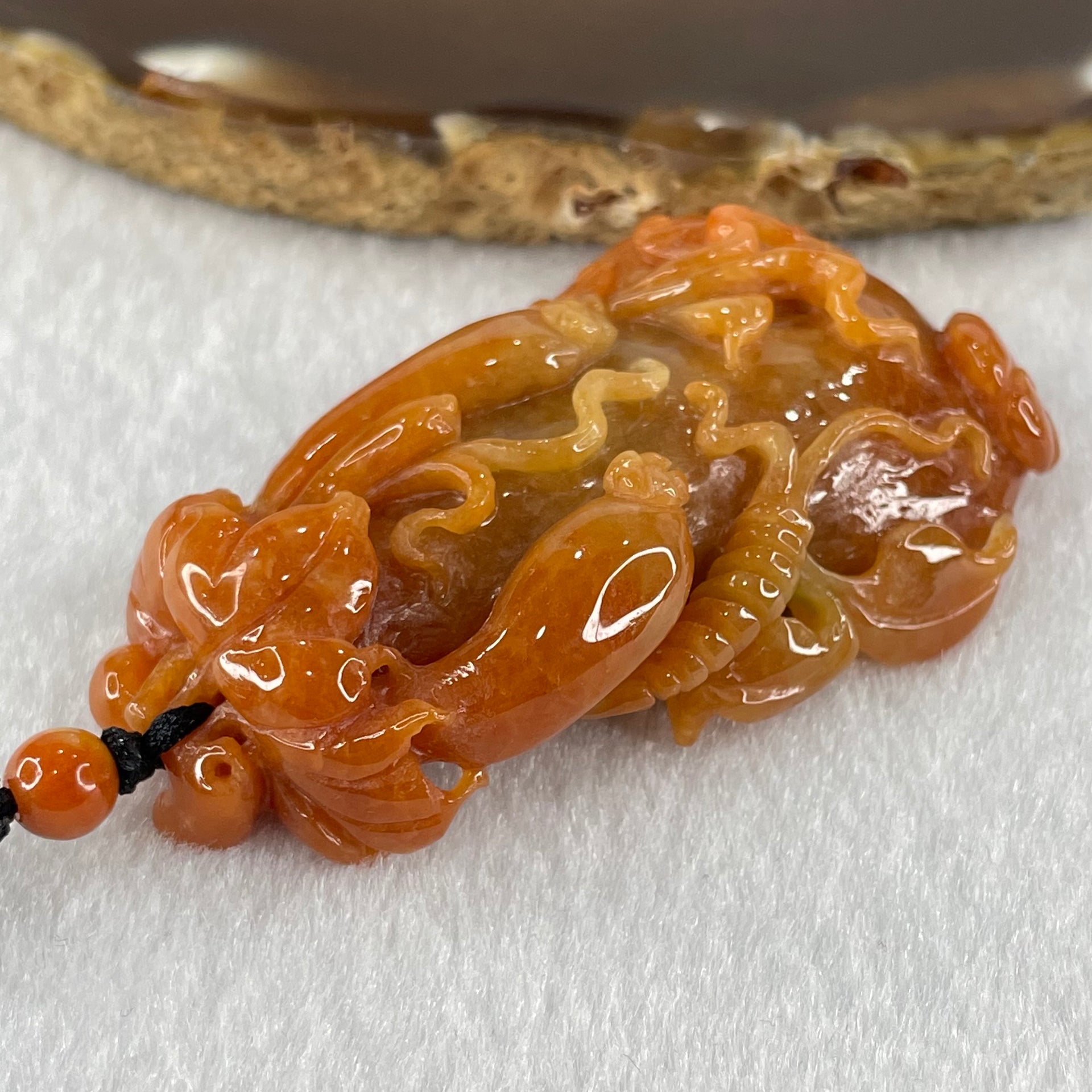 Grandmaster Type A Brownish Orange to Brownish Red Jadeite Melon and Ruyi 福瓜 Pendant 45.95g 58.05 by 34.38 by 15.00mm With NGI Cert 82838787 - Huangs Jadeite and Jewelry Pte Ltd