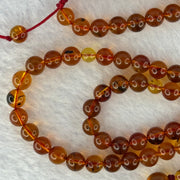 Natural Cognac Amber Ruyi Pendent 37.7 by 27.0 by 12.2mm in Amber Beads Necklace 6.3mm 105 Beads Total 19.80g - Huangs Jadeite and Jewelry Pte Ltd