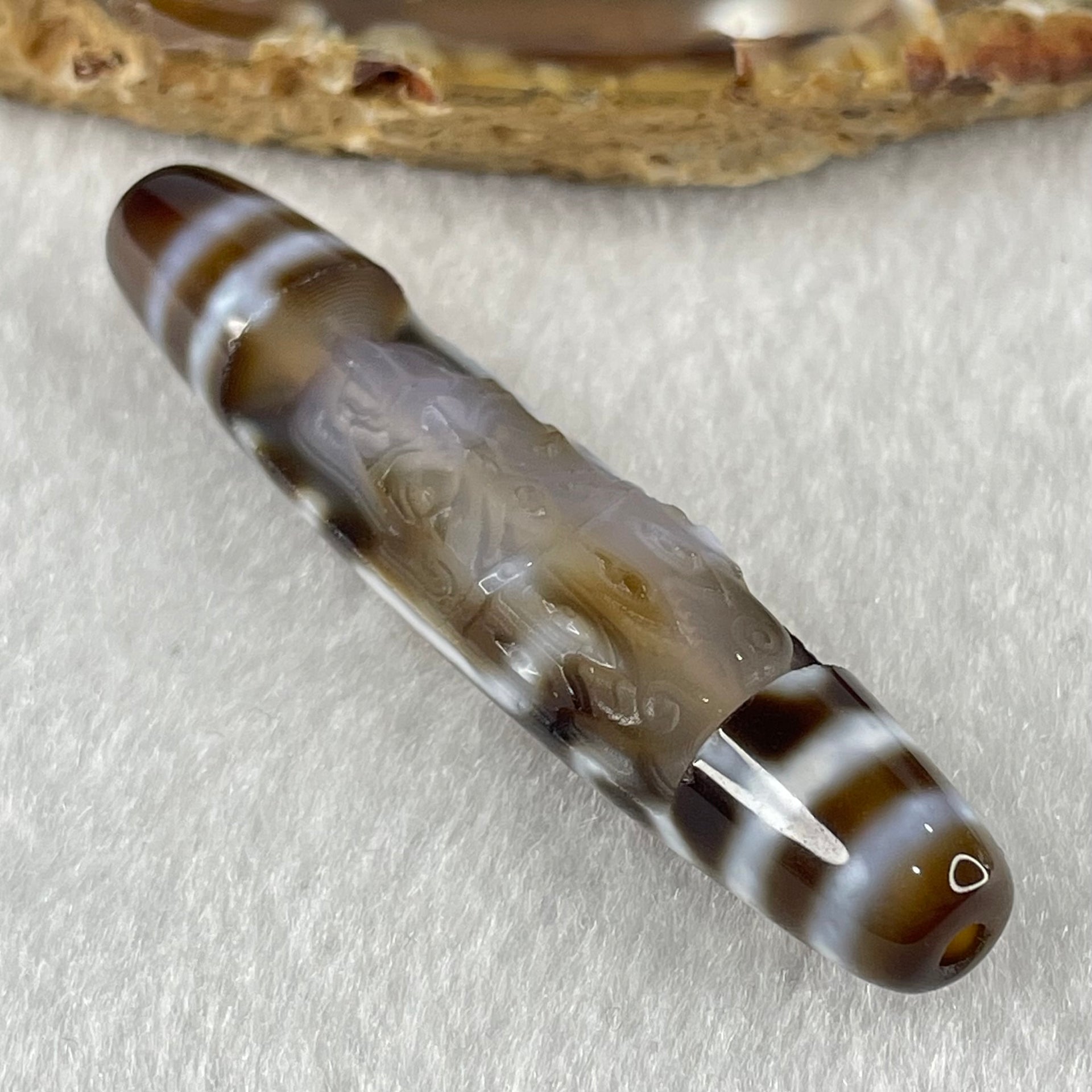 Natural Powerful Tibetan Old Oily Agate Zha Ji La Mu Female Cai Shen Carvings on 9 Eyes Dzi Bead Heavenly Master (Tian Zhu) 九眼扎基拉姆女财神天珠 11.04g 57.9 by 12.0mm - Huangs Jadeite and Jewelry Pte Ltd