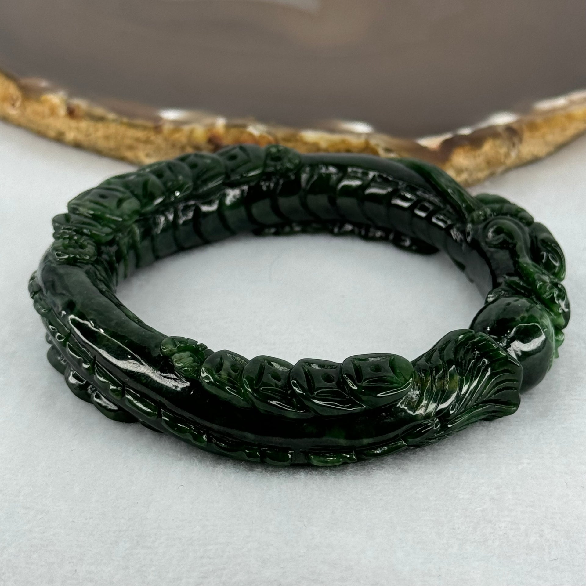 Type A Translucent to Opaque Old Mine Spicy Green Jadeite Dragon Bangle Internal Diameter 56.30mm 374.20cts 74.75g 16.0 by 12.5mm With NGI Cert 32885979 (Slight Internal Lines) - Huangs Jadeite and Jewelry Pte Ltd