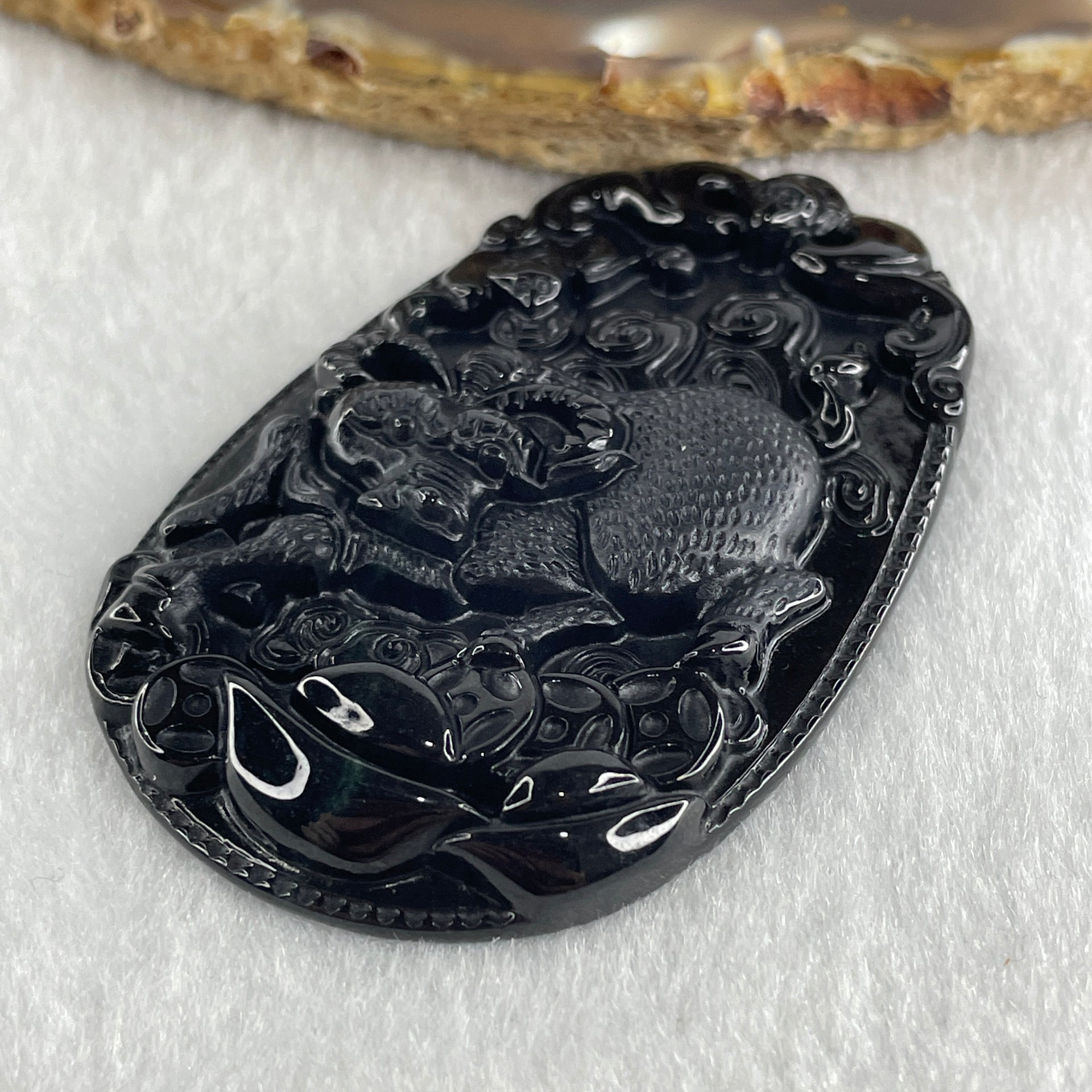 Type A Opaque to Partial Translucent Black Omphacite Jadeite Ox Pendant 20.24g 59.5 by 39.4 by 7.6mm - Huangs Jadeite and Jewelry Pte Ltd