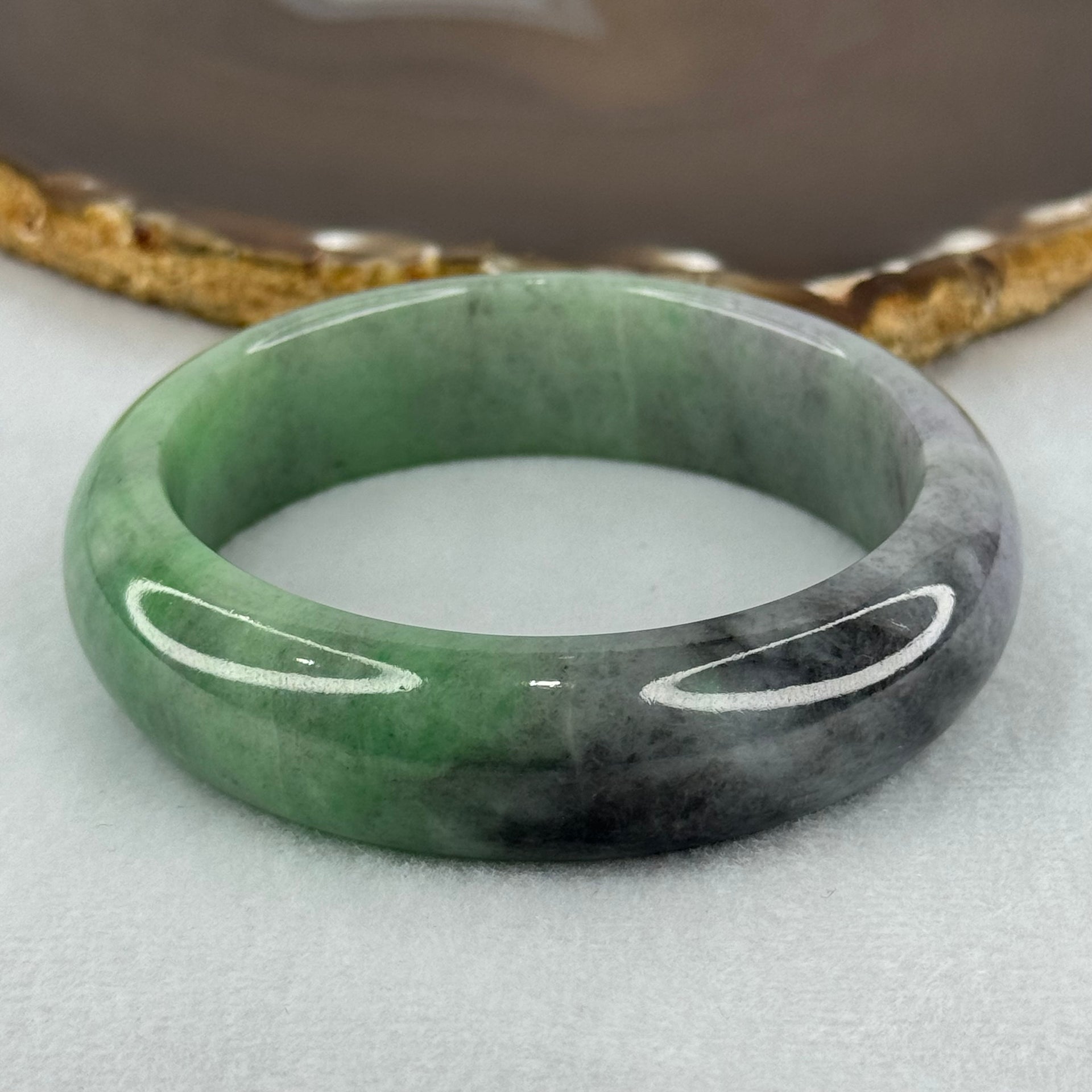 Type A Translucent Light Green with Patches of Faint Grey and Greyish Black Jadeite Bangle Internal Diameter 57.75mm 404.45cts 81.28g 17.3 by 9.0mm With NGI Cert No 32885808 (Very Slight Internal Lines) - Huangs Jadeite and Jewelry Pte Ltd