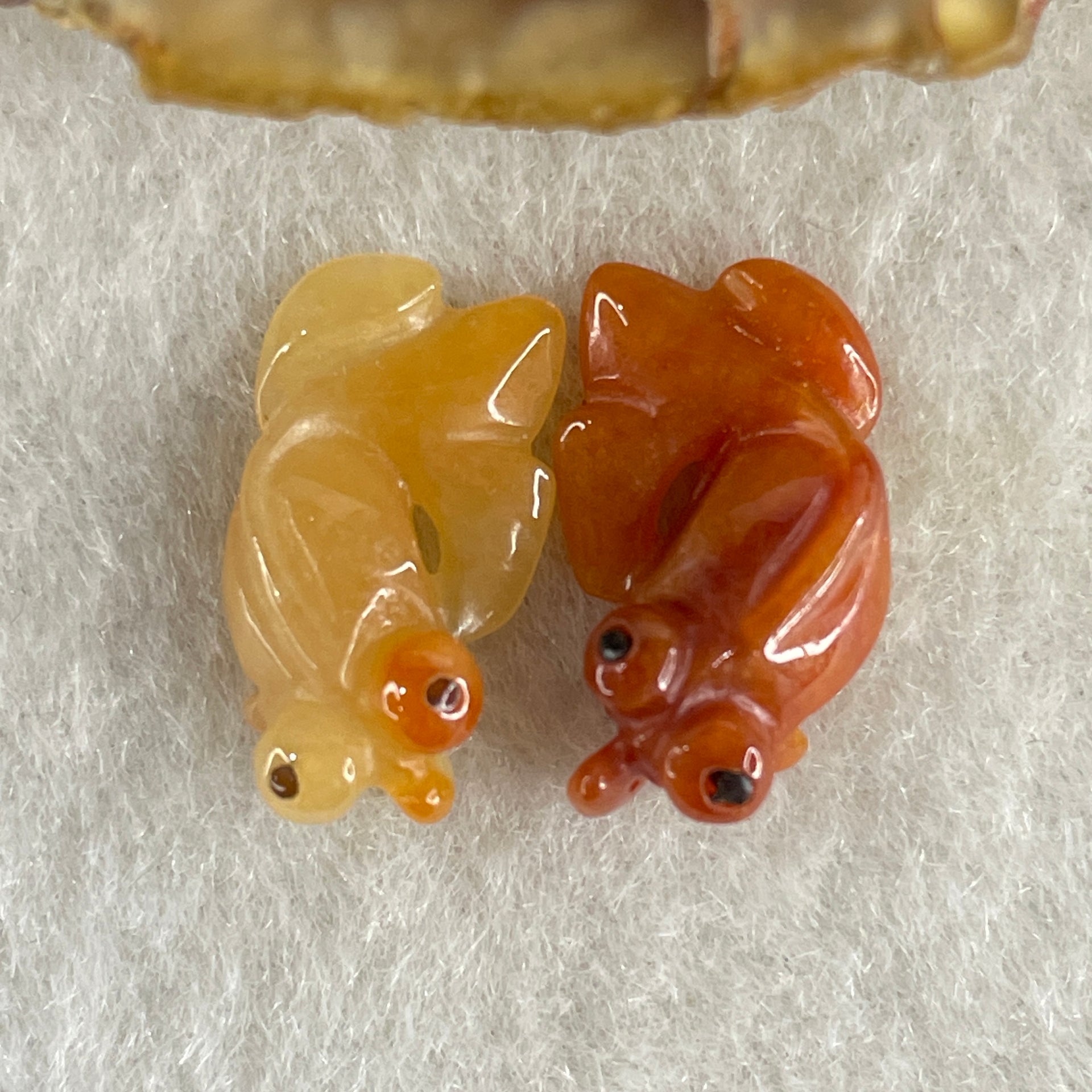 Natural Type A Yellow and Red Jadeite Pair Gold Fish Charm each 0.97g 16.9 by 9.4 by 5.5mm and 1.21g 17.0 by 9.8 by 5.7mm - Huangs Jadeite and Jewelry Pte Ltd