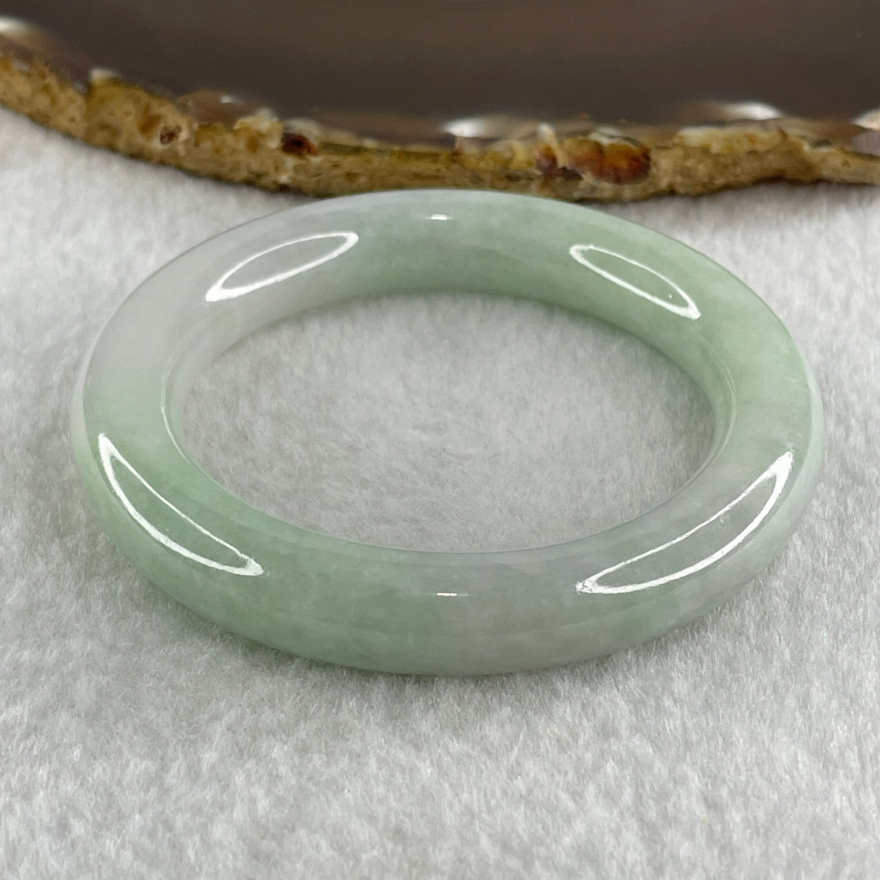 Type A Natural Jelly Light Green Faint Lavender Jadeite Bangle 52.53g Inner Diameter 49.5mm 10.4 by 10.2mm (Internal Lines) - Huangs Jadeite and Jewelry Pte Ltd