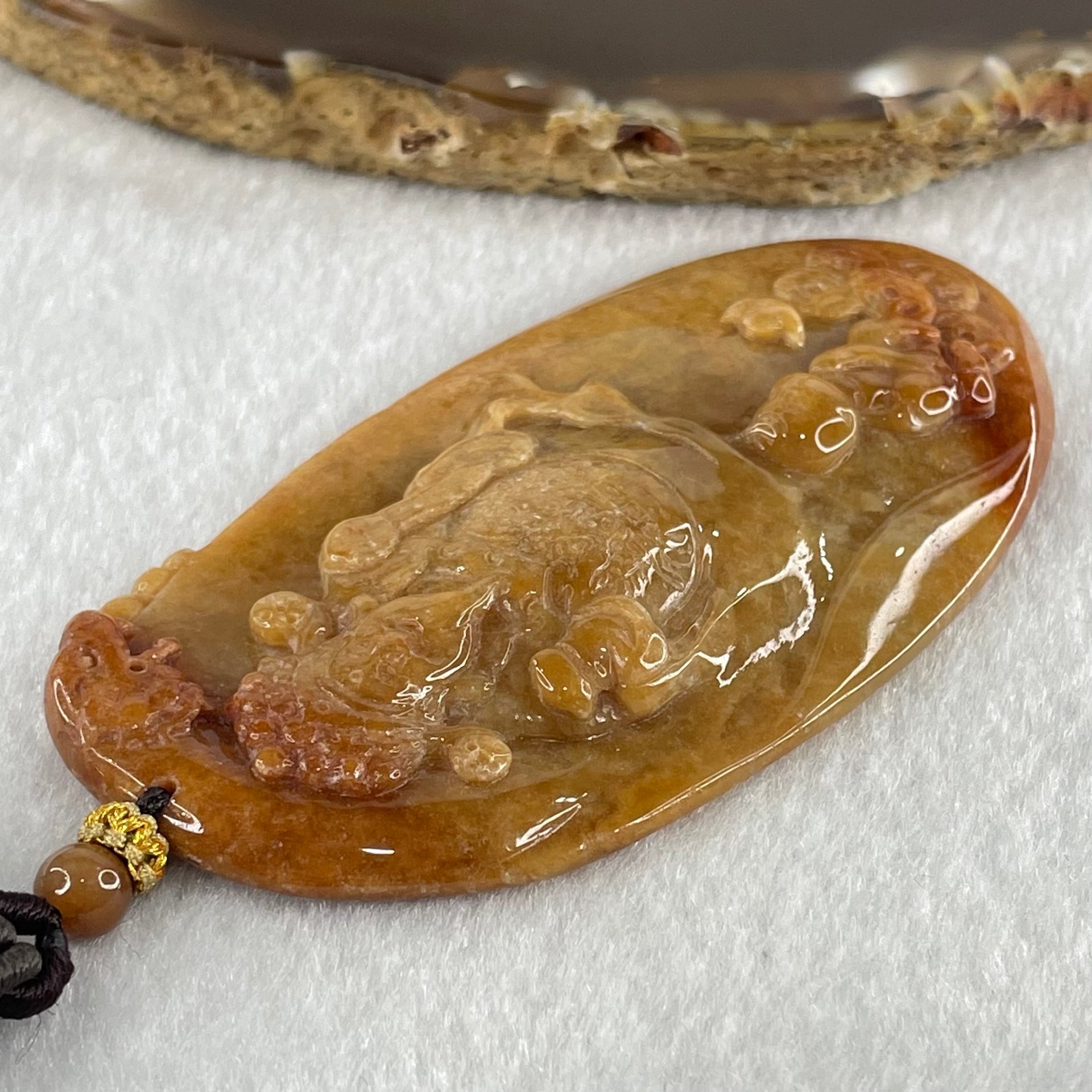 Grandmaster Type A Brown with Reddish  Patches Jadeite Cai Shen with Tong Zi Ingot and Dragon  Pendant 吉星高照 48.68g 76 by 39.7 by 6.3mm - Huangs Jadeite and Jewelry Pte Ltd