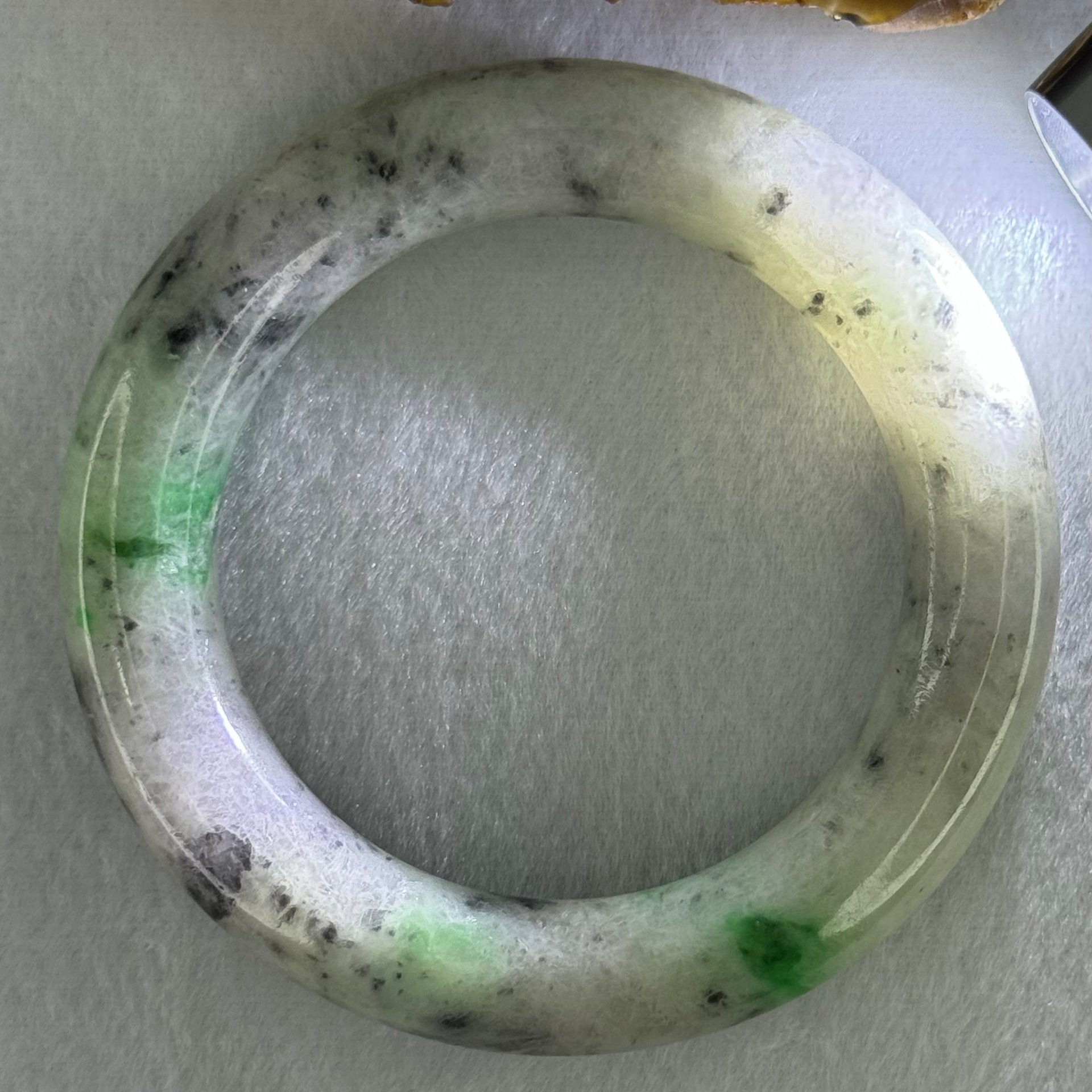 Type A Light Green with Emerald Green and Grey Patches Jadeite Bangle Internal Diameter 55.8mm 93.21g 13.4 by 13.1mm (Very Slight External Rough with Slight Internal Lines) - Huangs Jadeite and Jewelry Pte Ltd