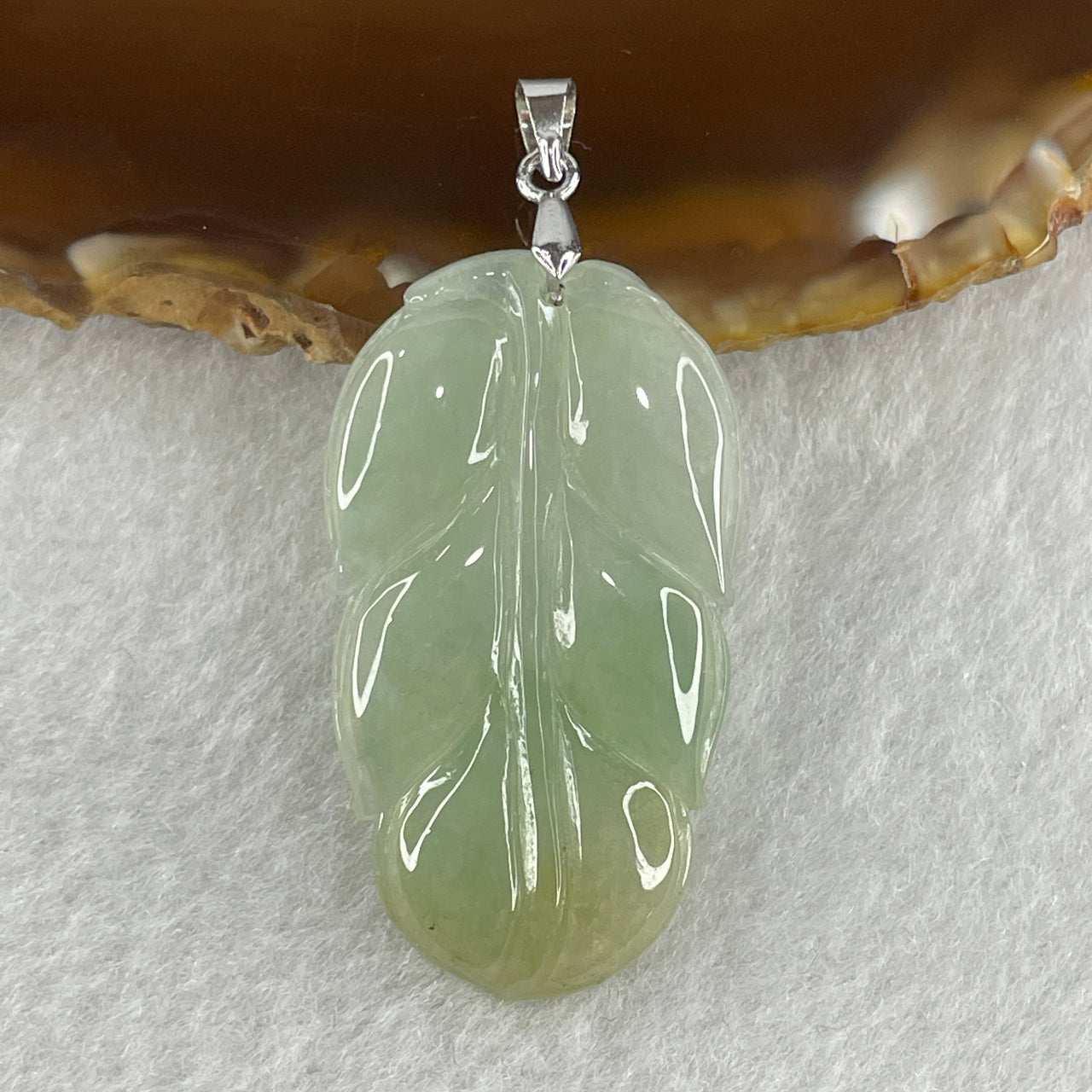 Natural Type A Semi Icy Light Green with Light Yellow Jadeite Prosperity Leaf Pendant in Silver Clasp Signifying Overnight Success 6.55g 38.4 by 21.6 by 4.0mm - Huangs Jadeite and Jewelry Pte Ltd