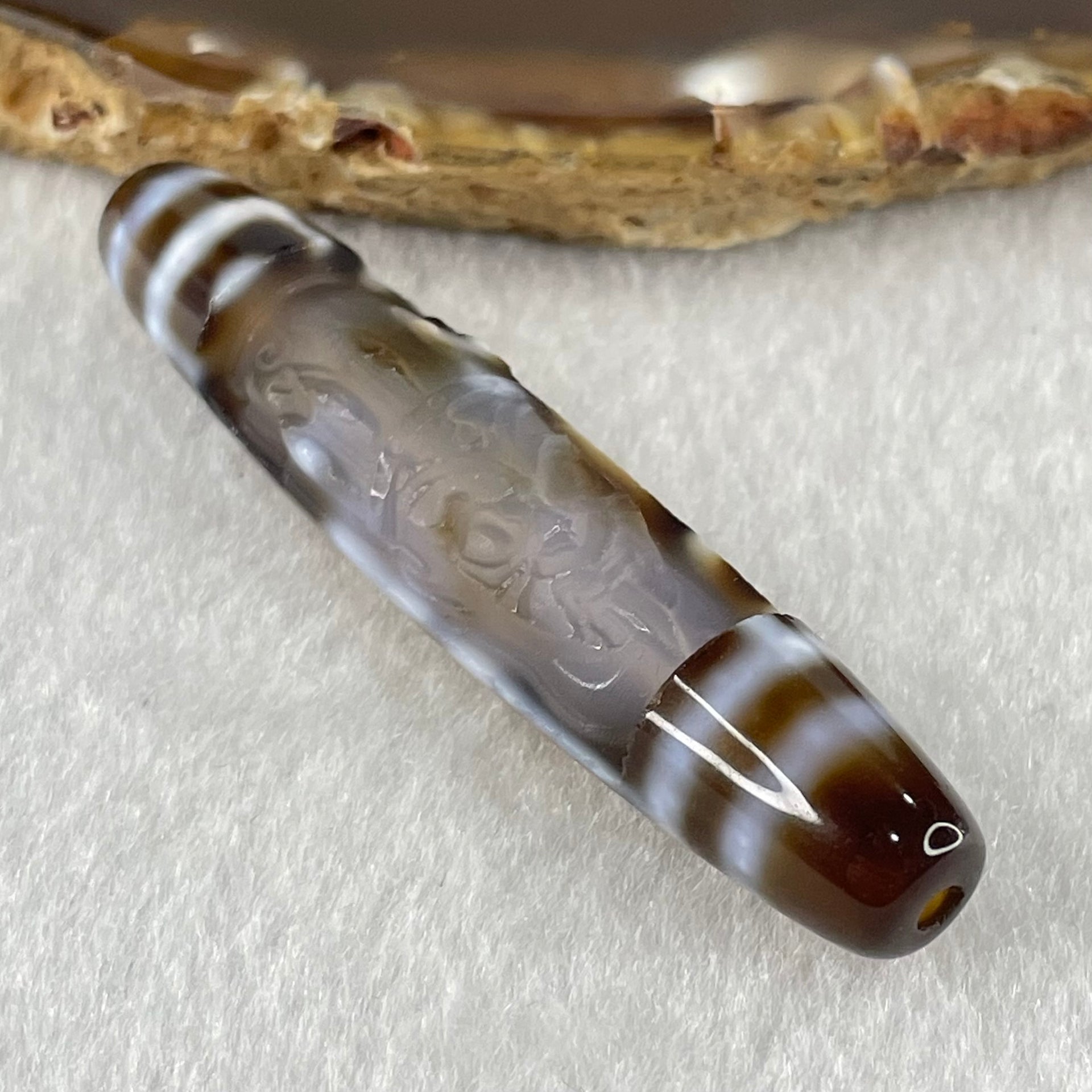 Natural Powerful Tibetan Old Oily Agate Zha Ji La Mu Female Cai Shen Carvings on 9 Eyes Dzi Bead Heavenly Master (Tian Zhu) 九眼扎基拉姆女财神天珠 11.04g 57.9 by 12.0mm - Huangs Jadeite and Jewelry Pte Ltd