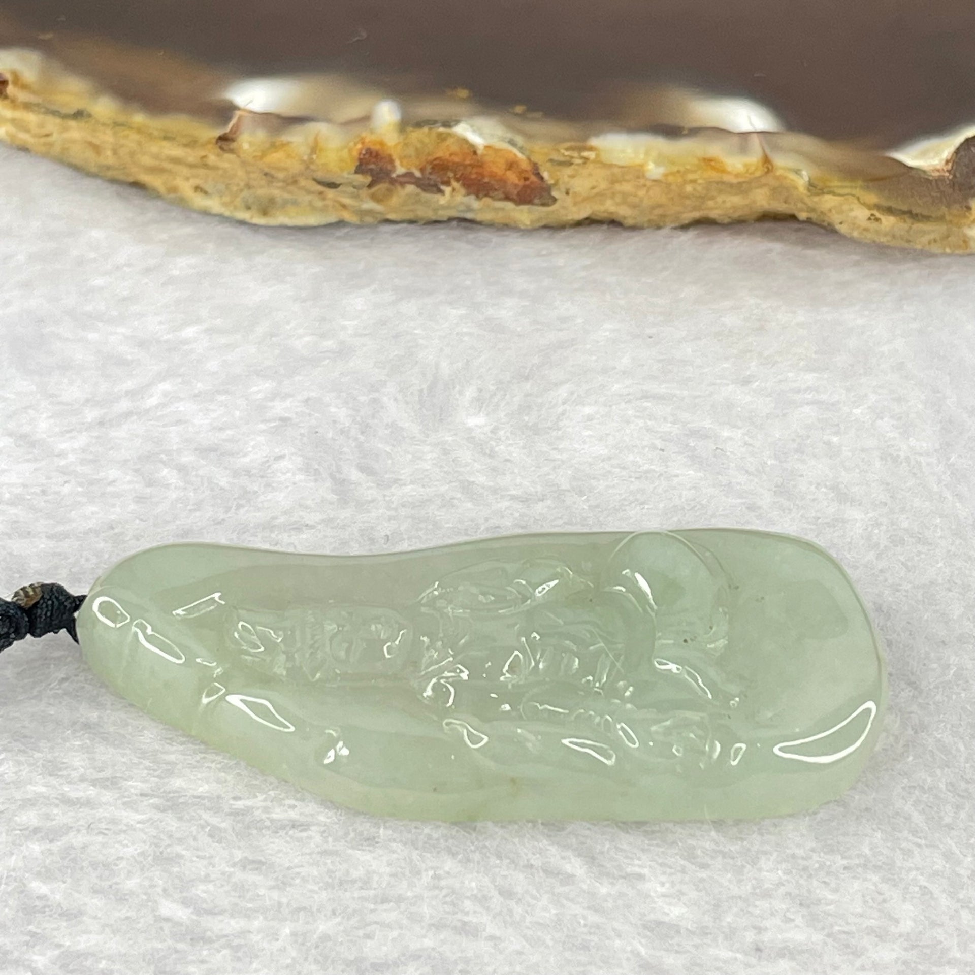 Type A Semi Icy Green Jadeite Guan Yin Pendent 11.98g 48.0 by 21.3 by 5.4mm - Huangs Jadeite and Jewelry Pte Ltd