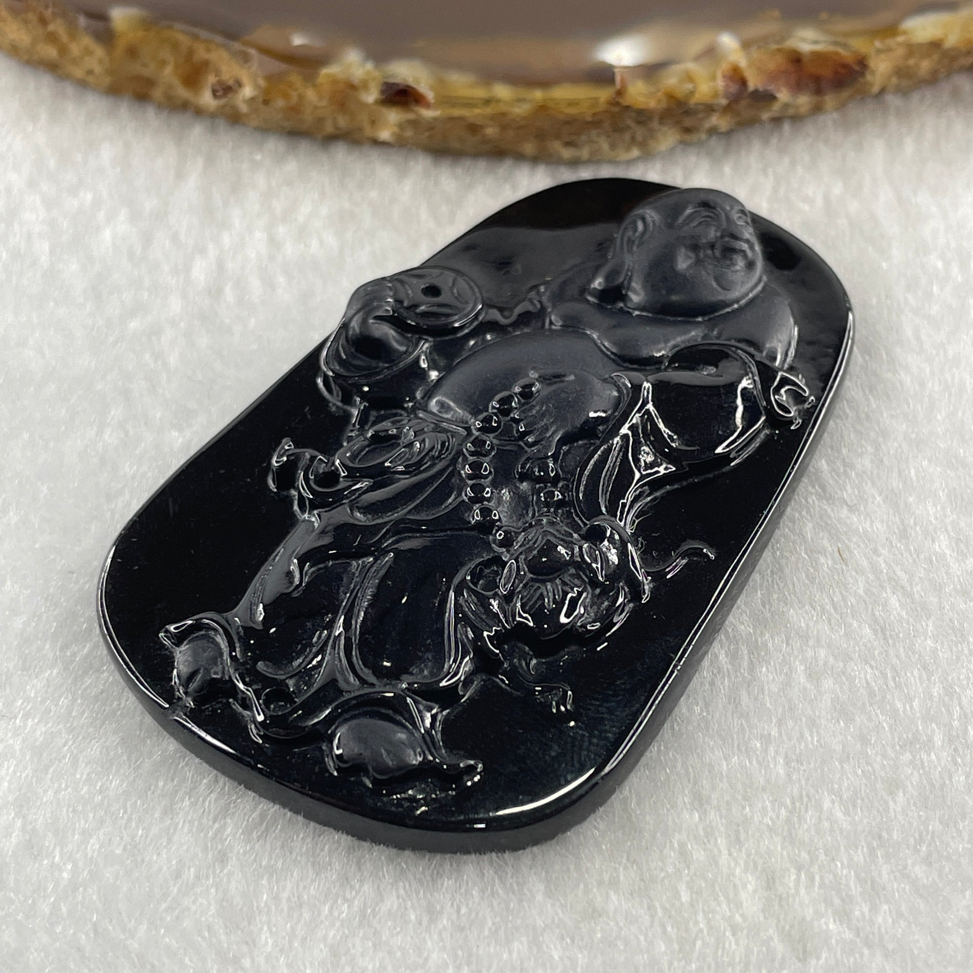 Type A Opaque to Partial Translucent Black Omphacite Jadeite Milo Laughing Buddha Pendant 22.86g 64.6 by 40.5 by 8.7mm - Huangs Jadeite and Jewelry Pte Ltd