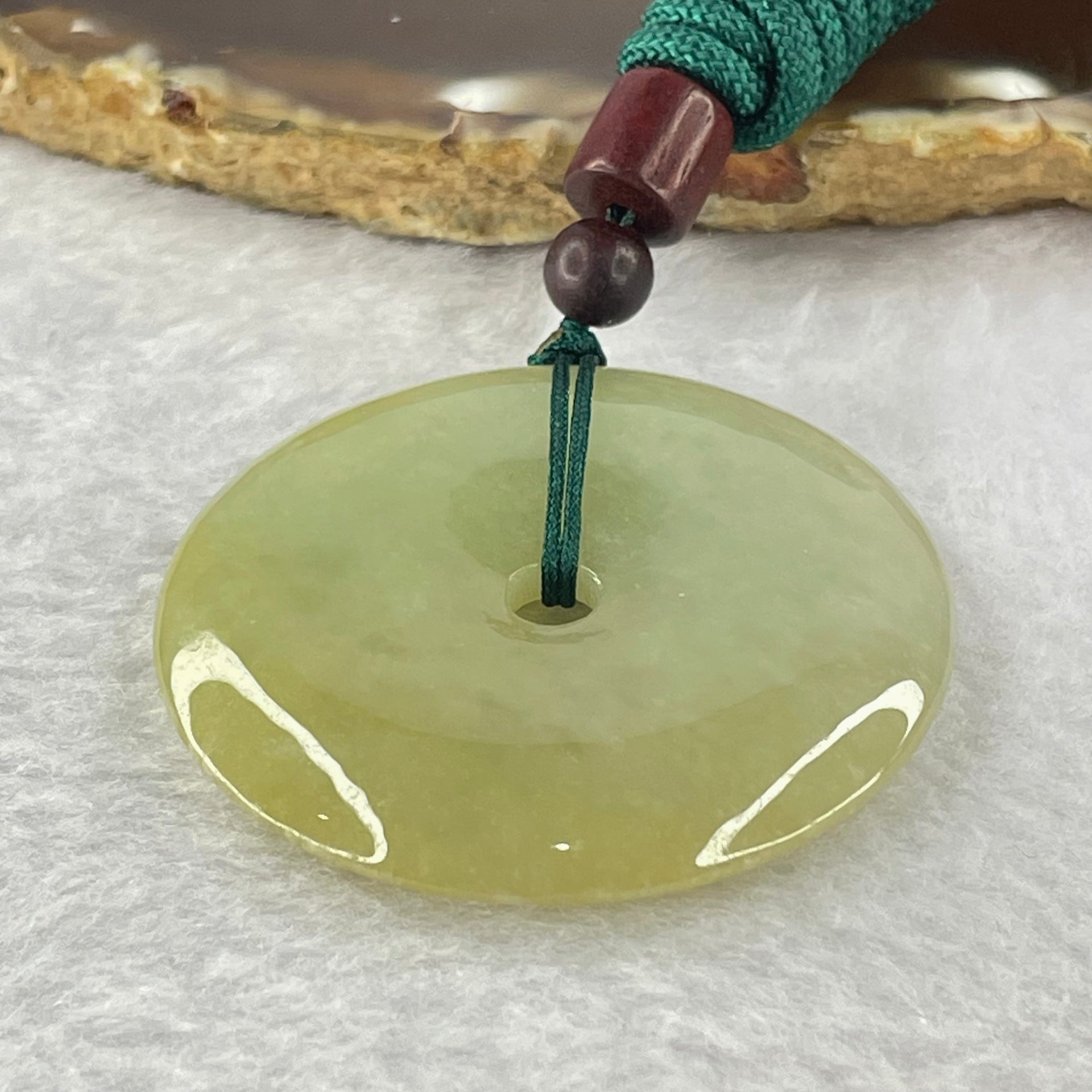 Type A Yellowish Green Jadeite Ping An Kou Donut Pendent 24.41g 43.0 by 7.1mm - Huangs Jadeite and Jewelry Pte Ltd
