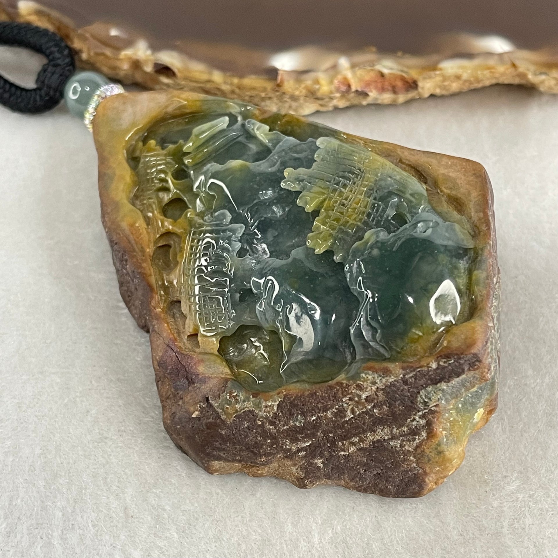 Grand Master Type A Brown with Blueish Green Jadeite Shan Shui with Guiren Benefactor Pendant 107.48g 74.0 by 53.9 by 23.3mm - Huangs Jadeite and Jewelry Pte Ltd