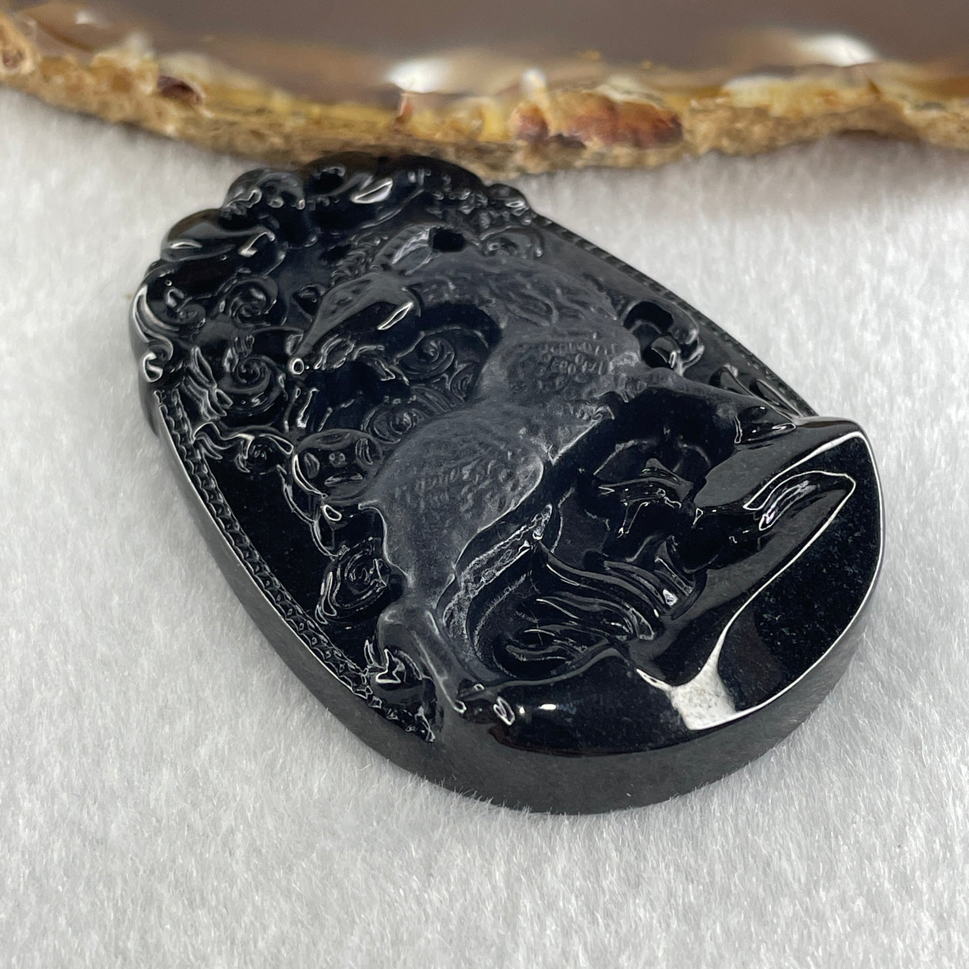 Type A Opaque to Partial Translucent Black Omphacite Jadeite Goat Pendant 27.85g 59.9 by 40.6 by 9.8mm - Huangs Jadeite and Jewelry Pte Ltd