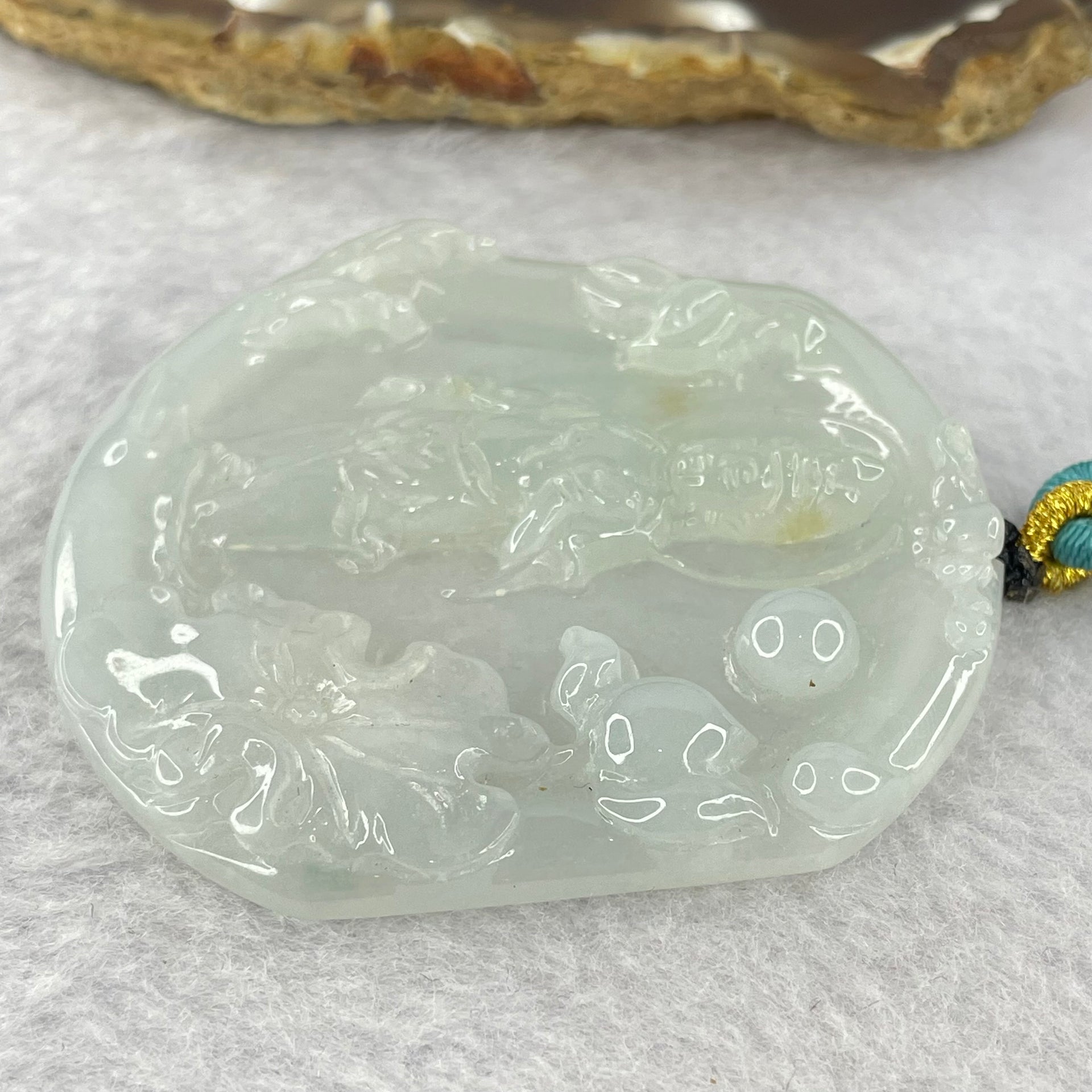 Type A Light Green to white Jadeite Guan Yin Pendent 32.29g 57.8 by 52.6 by 6.6mm - Huangs Jadeite and Jewelry Pte Ltd