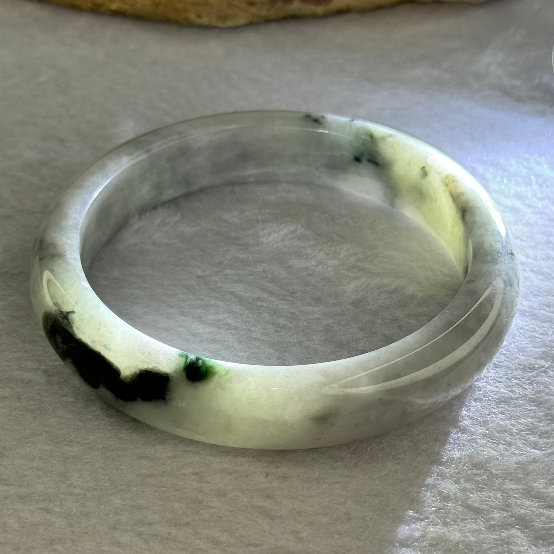 Type A Green Lavender with Dark Green Patches 50.67g Internal Diameter 57.5mm 12.6 by 8.2mm (Internal Lines) - Huangs Jadeite and Jewelry Pte Ltd