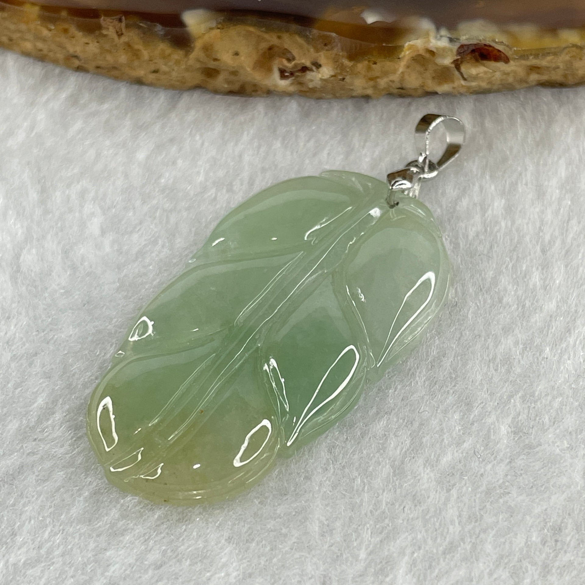 Natural Type A Semi Icy Light Green with Light Yellow Jadeite Prosperity Leaf Pendant in Silver Clasp Signifying Overnight Success 6.55g 38.4 by 21.6 by 4.0mm - Huangs Jadeite and Jewelry Pte Ltd
