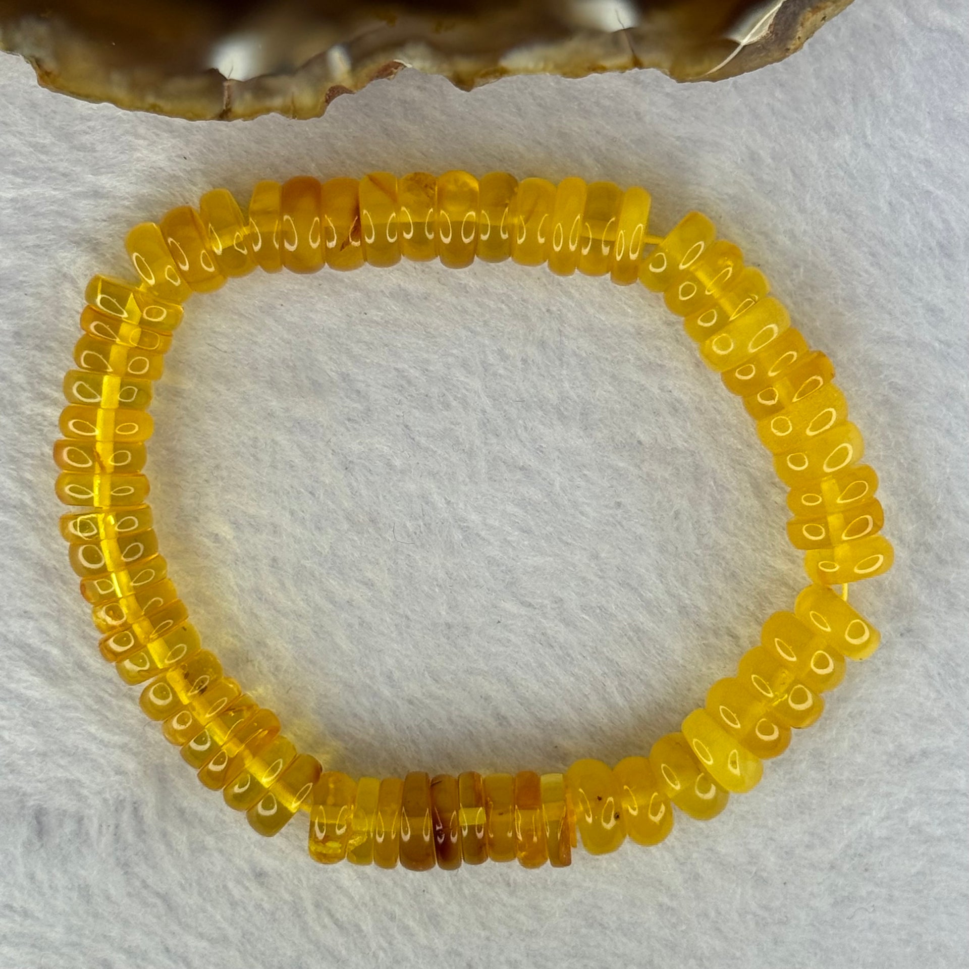 Natural Amber Ping An Kou Donut Shape Bracelet 天然琥珀手链 10.27g 16.5cm 9.2 by 3.3mm 70pcs - Huangs Jadeite and Jewelry Pte Ltd