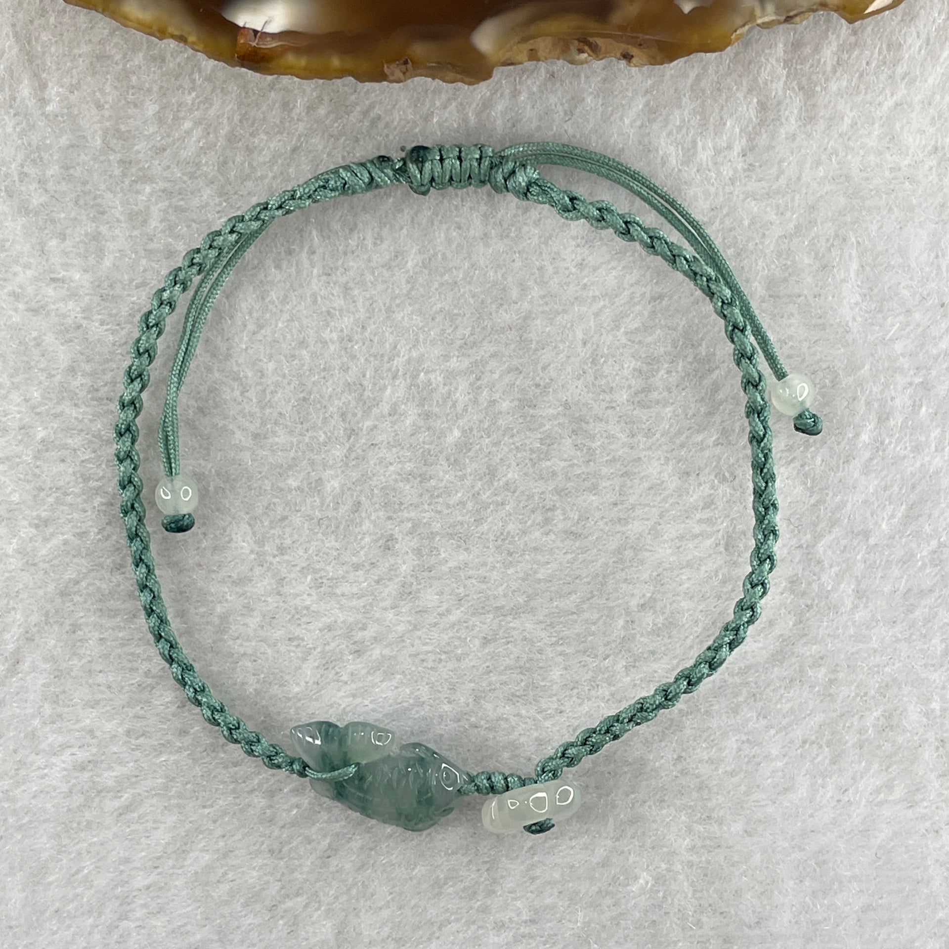Natural Type A Semi Icy Green with Dark Green Patches Jadeite Fish with Flower on String Bracelet 1.59g 15-18cm 15.6 by 7.9 by 3.5mm - Huangs Jadeite and Jewelry Pte Ltd