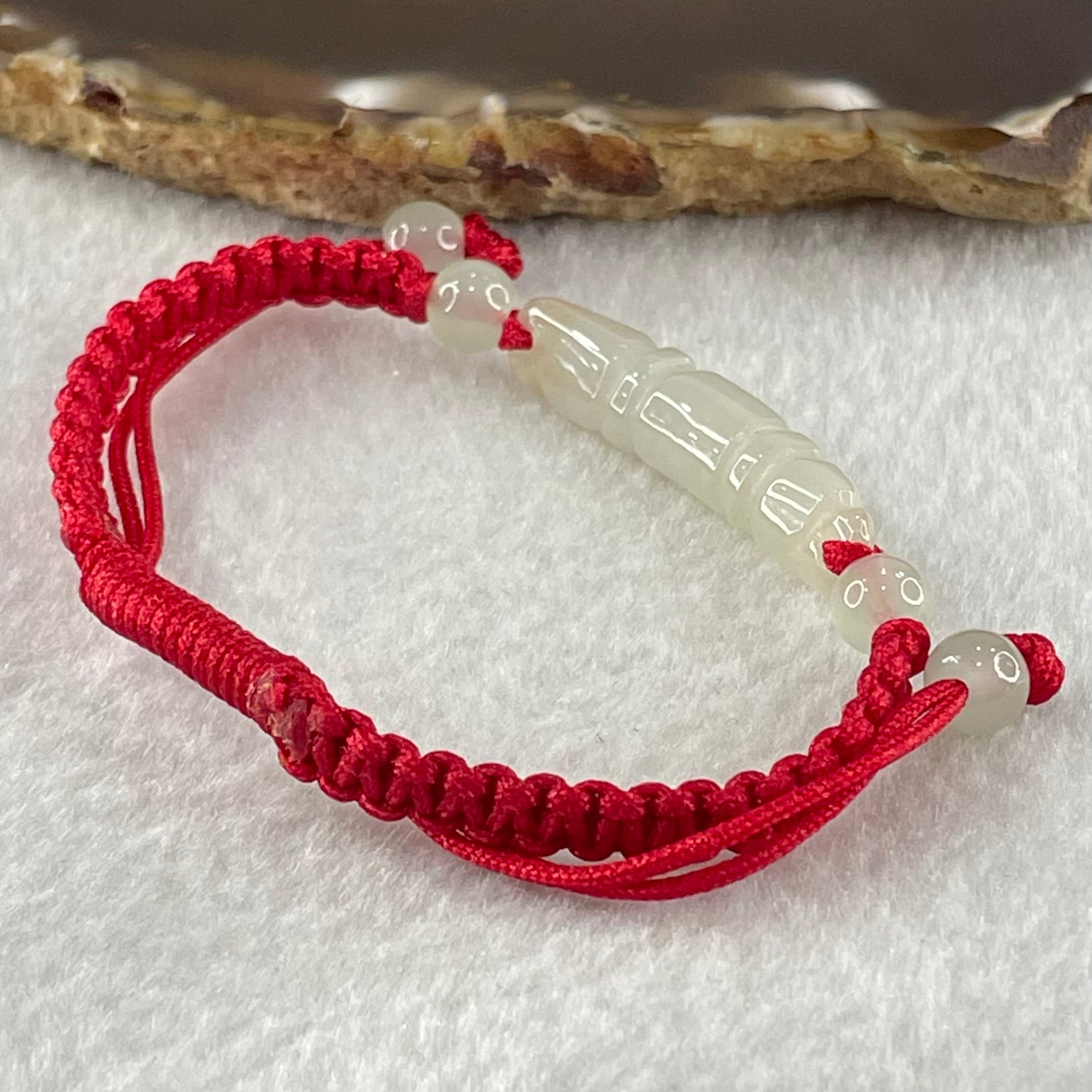 Type A Light Green Jadeite Scholarship Brush in Red String Bracelet 5.57g 6.7 by 7.5 by 33.5mm - Huangs Jadeite and Jewelry Pte Ltd