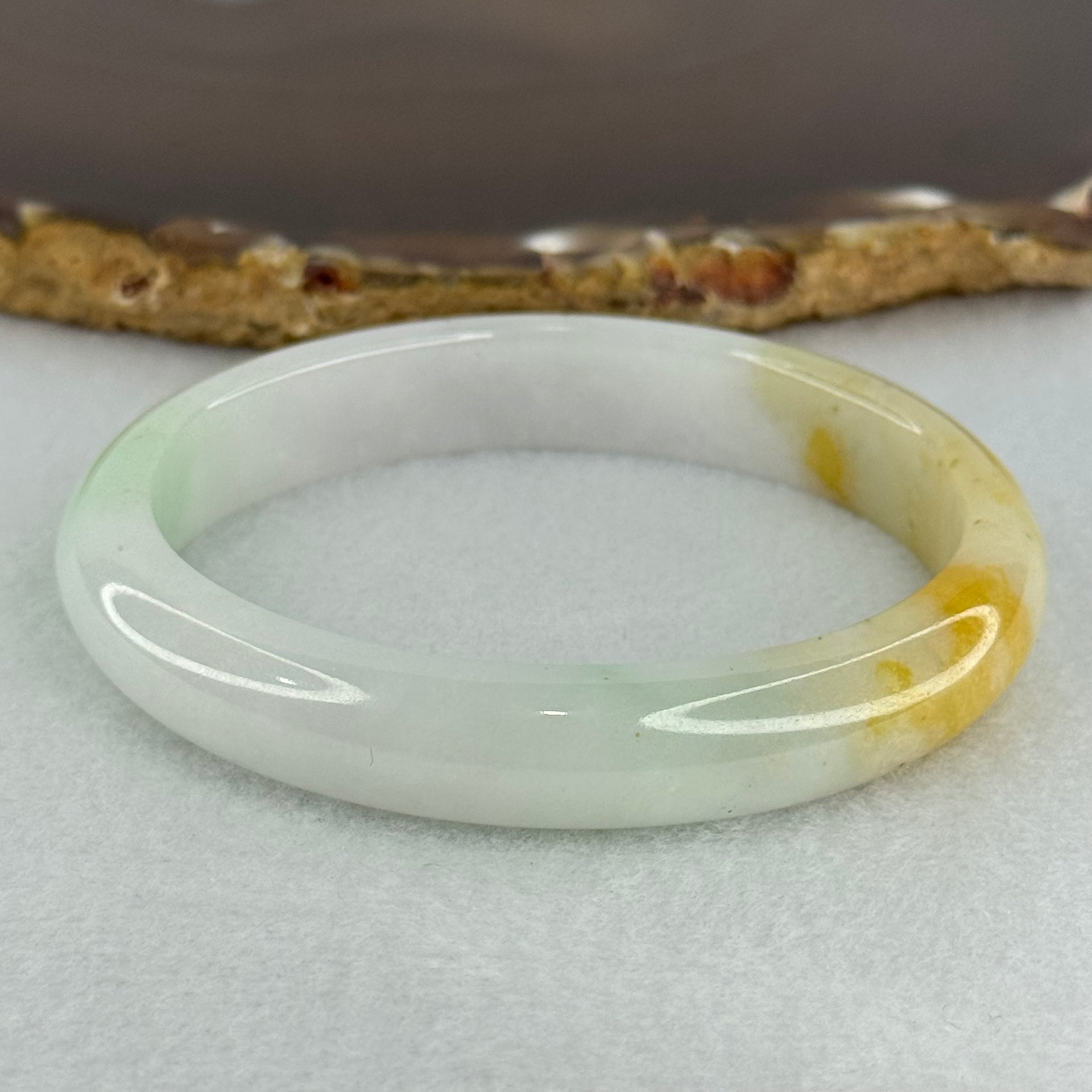 Type A Faint Lavender Green with Yellow Patches Jadeite Oval Bangle Internal Diameter 56.5mm  37.8696g 11.1 by 7.3mm (Very Slight Internal Line) - Huangs Jadeite and Jewelry Pte Ltd