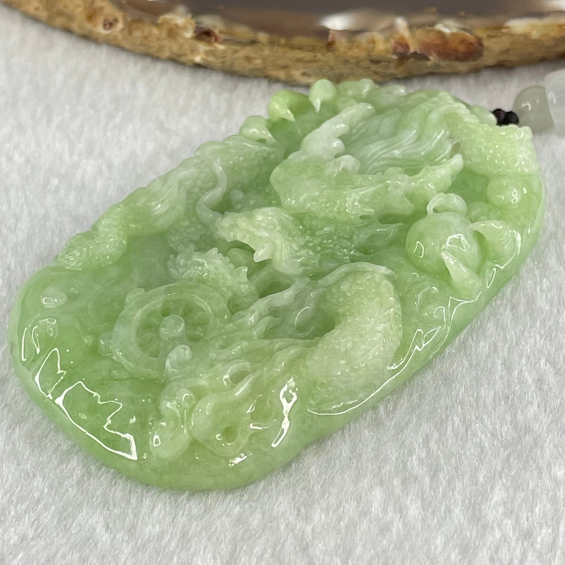 Type A Apple Green Jadeite Double Sided Fire Dragon Pendant 80.29g 75.3 by 44.4 by 13.2mm - Huangs Jadeite and Jewelry Pte Ltd