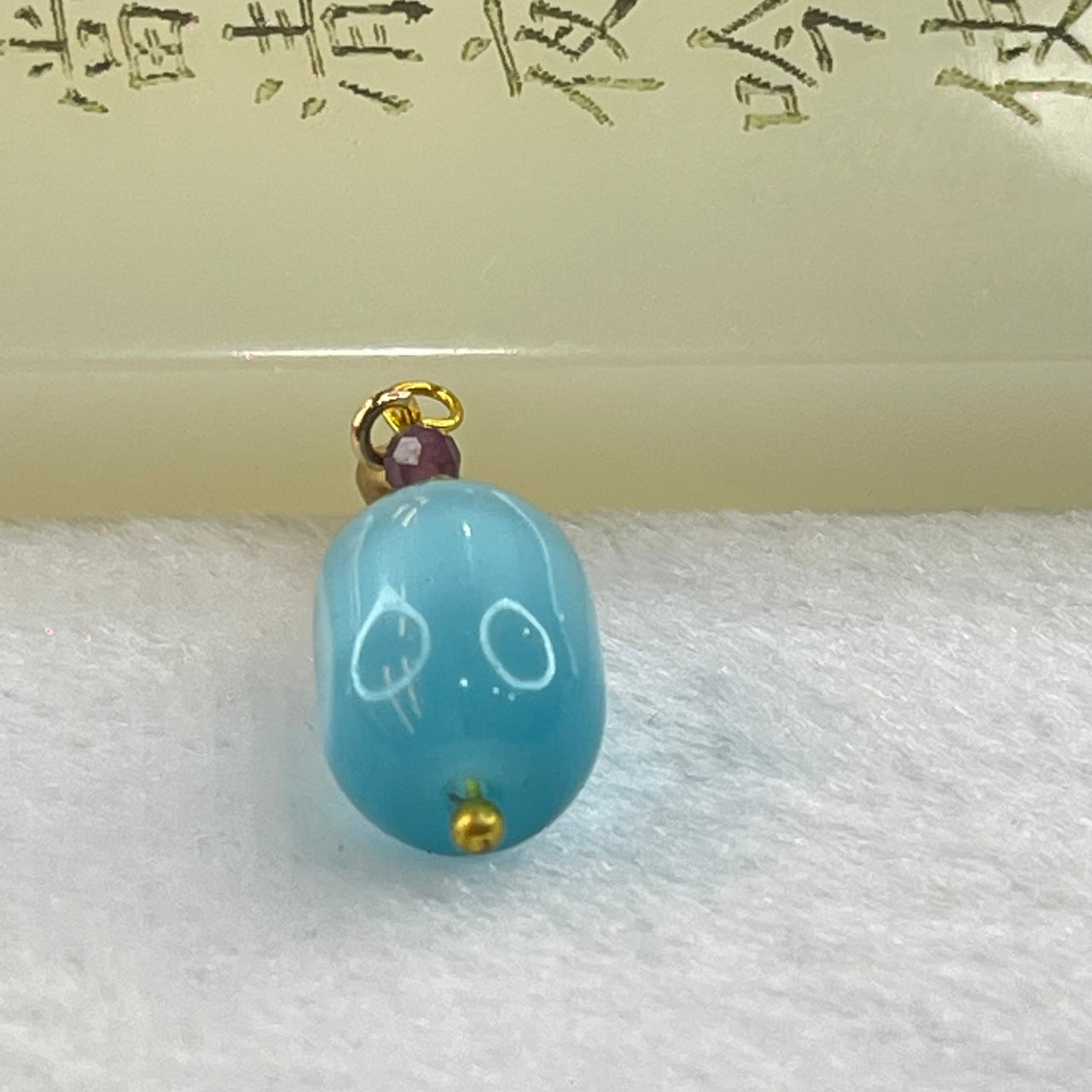 Blue Cat's Eye Glass Charm Pendent 2.31g 13.7 by 9.7mm - Huangs Jadeite and Jewelry Pte Ltd