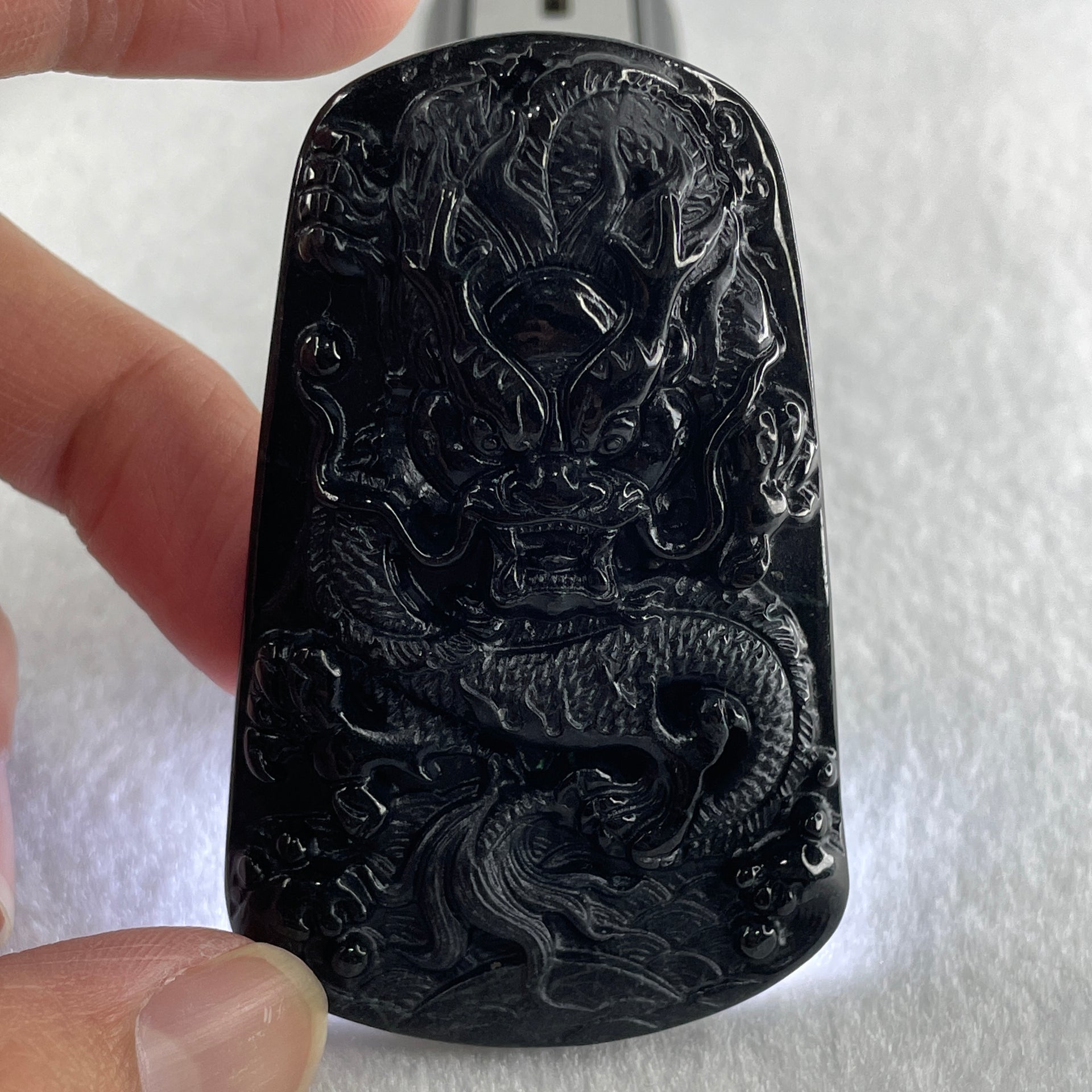 Type A Opaque to Partial Translucent Black Omphacite Jadeite Dragon Pendant 32.91g 66.0 by 42.2 by 9.5mm - Huangs Jadeite and Jewelry Pte Ltd