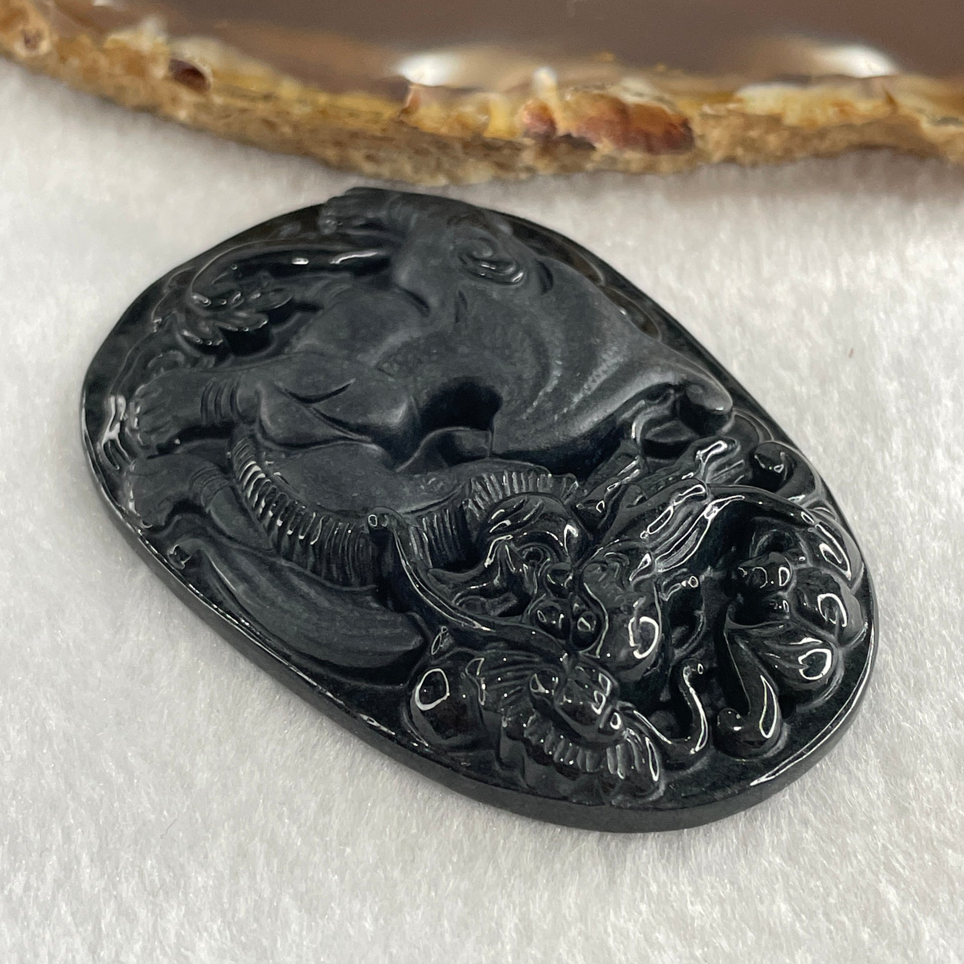 Type A Opaque to Partial Translucent Black Omphacite Jadeite Flying Pixiu Pendant 27.31g 61.2 by 42.5 by 9.3mm - Huangs Jadeite and Jewelry Pte Ltd