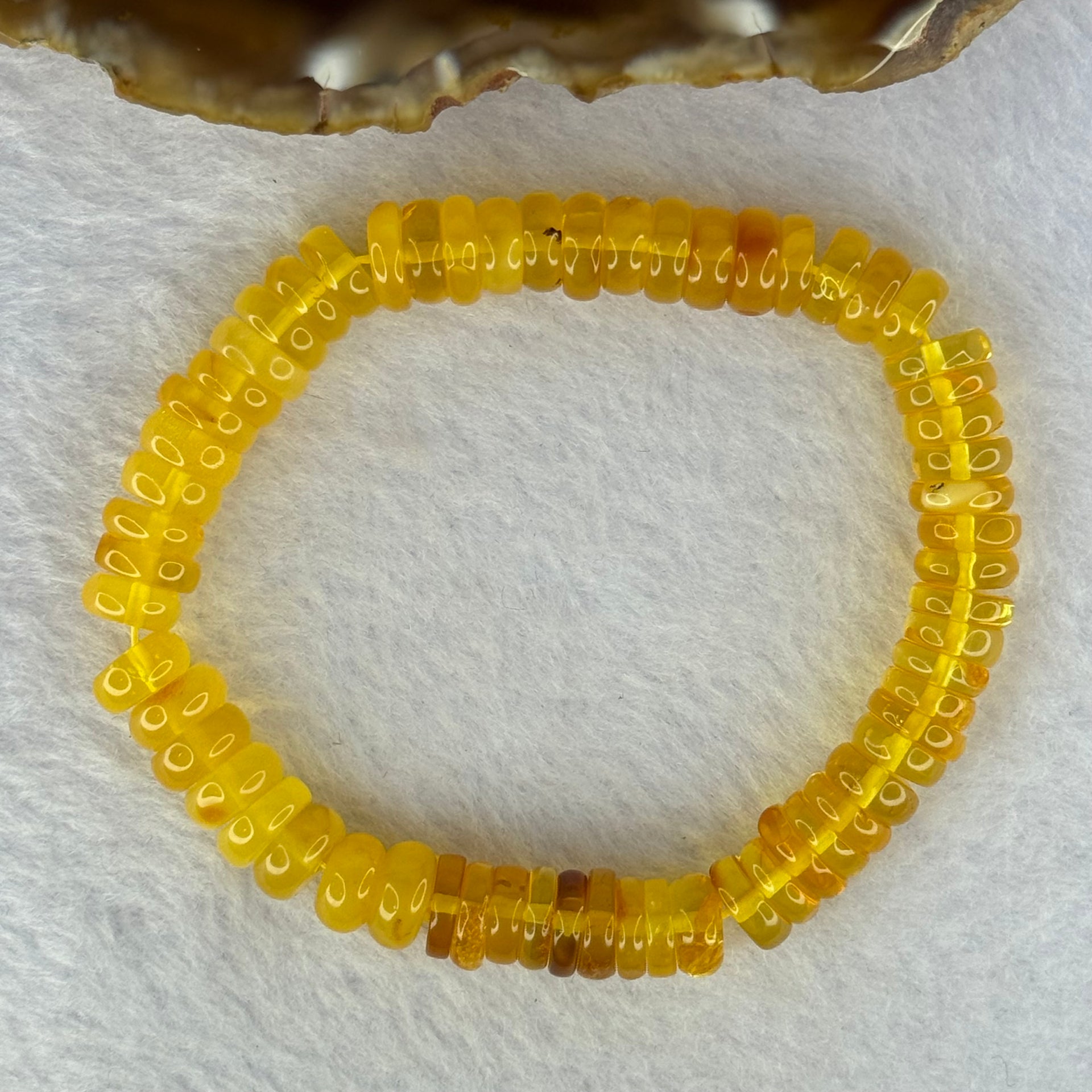 Natural Amber Ping An Kou Donut Shape Bracelet 天然琥珀手链 10.27g 16.5cm 9.2 by 3.3mm 70pcs - Huangs Jadeite and Jewelry Pte Ltd
