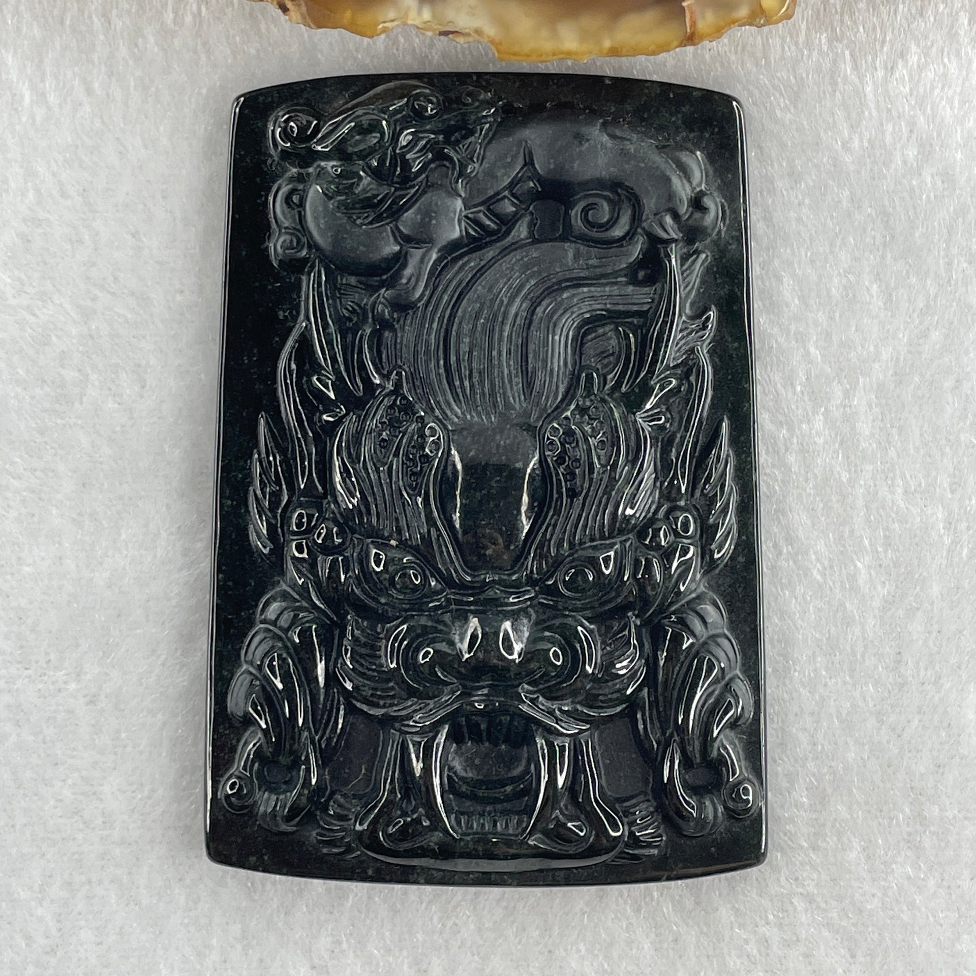 Type A Opaque to Partial Translucent Black Omphacite Jadeite Dragon with pixiu Pendant 45.42g 66.0 by 45.5 by 9.2mm - Huangs Jadeite and Jewelry Pte Ltd