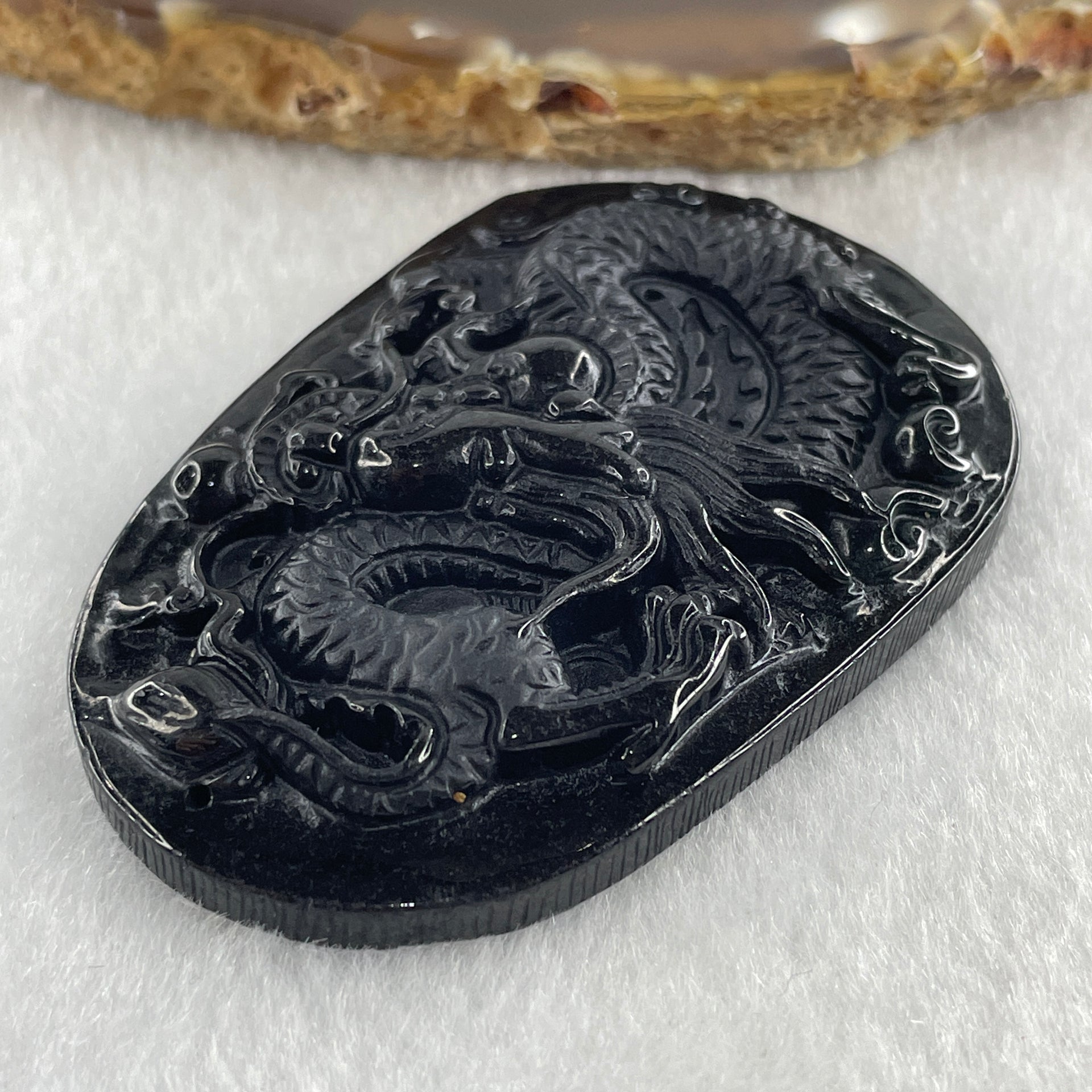 Type A Opaque to Partial Translucent Black Omphacite Jadeite Dragon Pendant 24.58g 58.2 by 40.3 by 8.2mm - Huangs Jadeite and Jewelry Pte Ltd