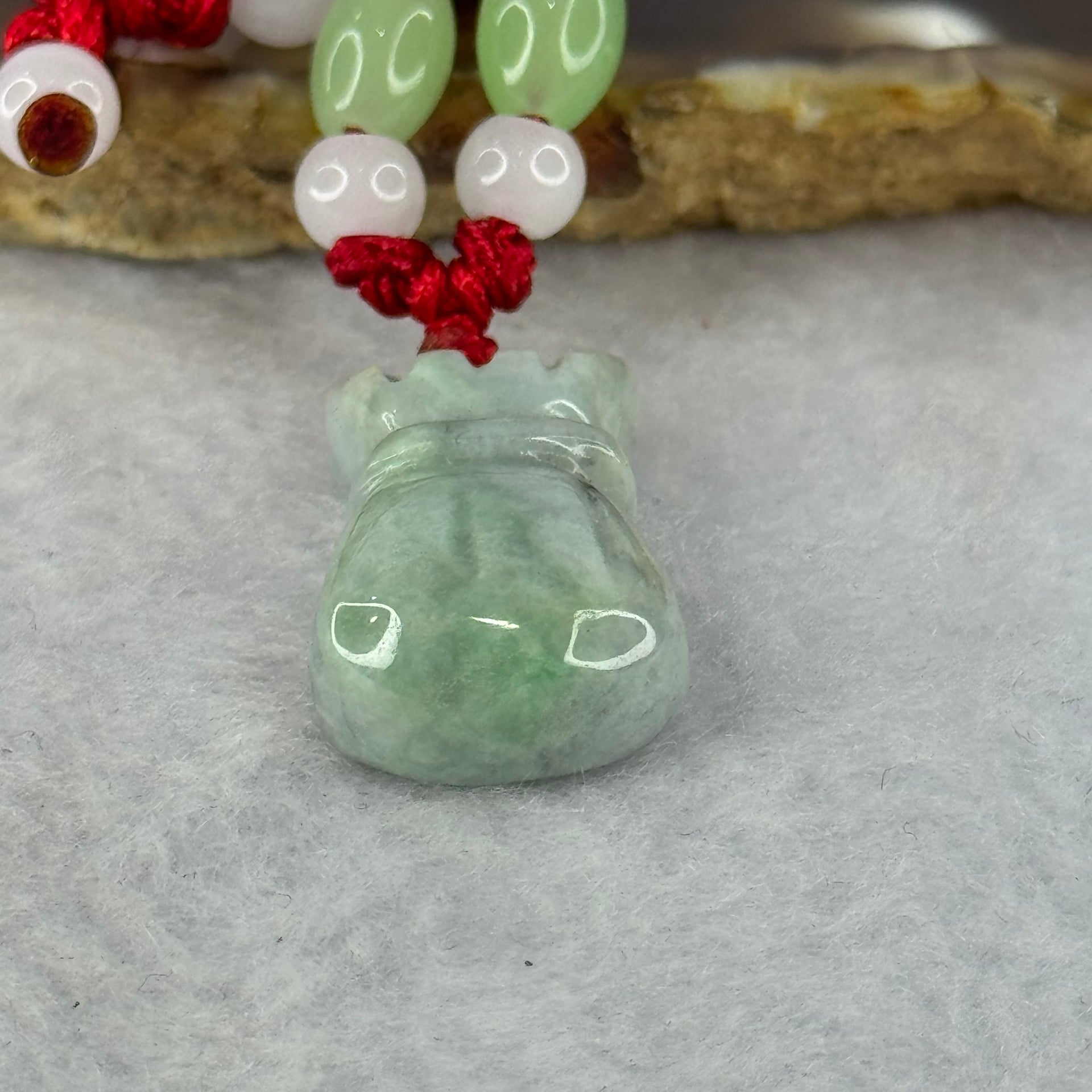 Type A Green Jadeite Money Bag Pendent 7.80g 24.9 by 14.4 by 8.2mm - Huangs Jadeite and Jewelry Pte Ltd