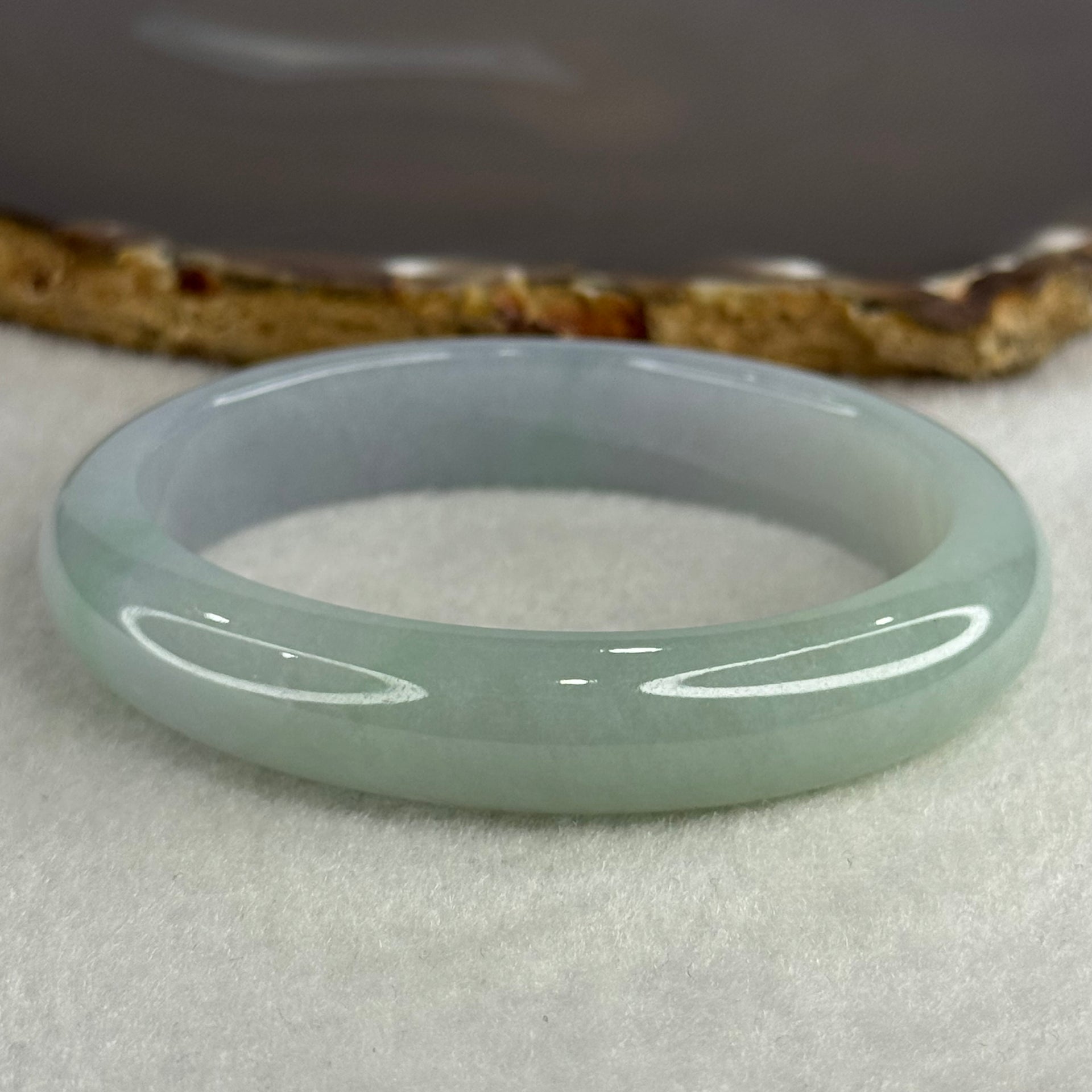 Type A Jelly Faint Green Faint Lavender Jadeite Oval Bangle 48.77g Inner Diameter 57.7mm 12.1 by 8.0mm with NGI Cert No. 32888362 (Internal Line) - Huangs Jadeite and Jewelry Pte Ltd
