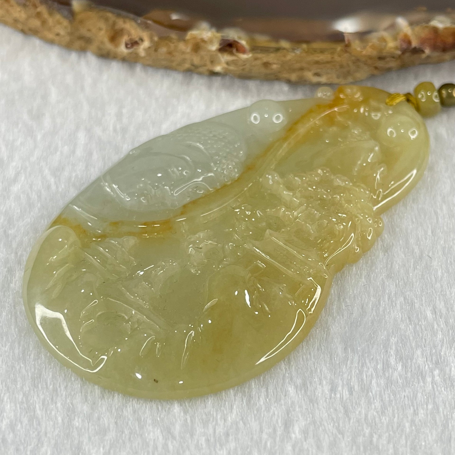 Grandmaster Type A Yellow with Faint Green and Red Jadeite Shan Shui with Buddha Pendant 22.54g 69.8 by 39.7 by 4.8mm - Huangs Jadeite and Jewelry Pte Ltd